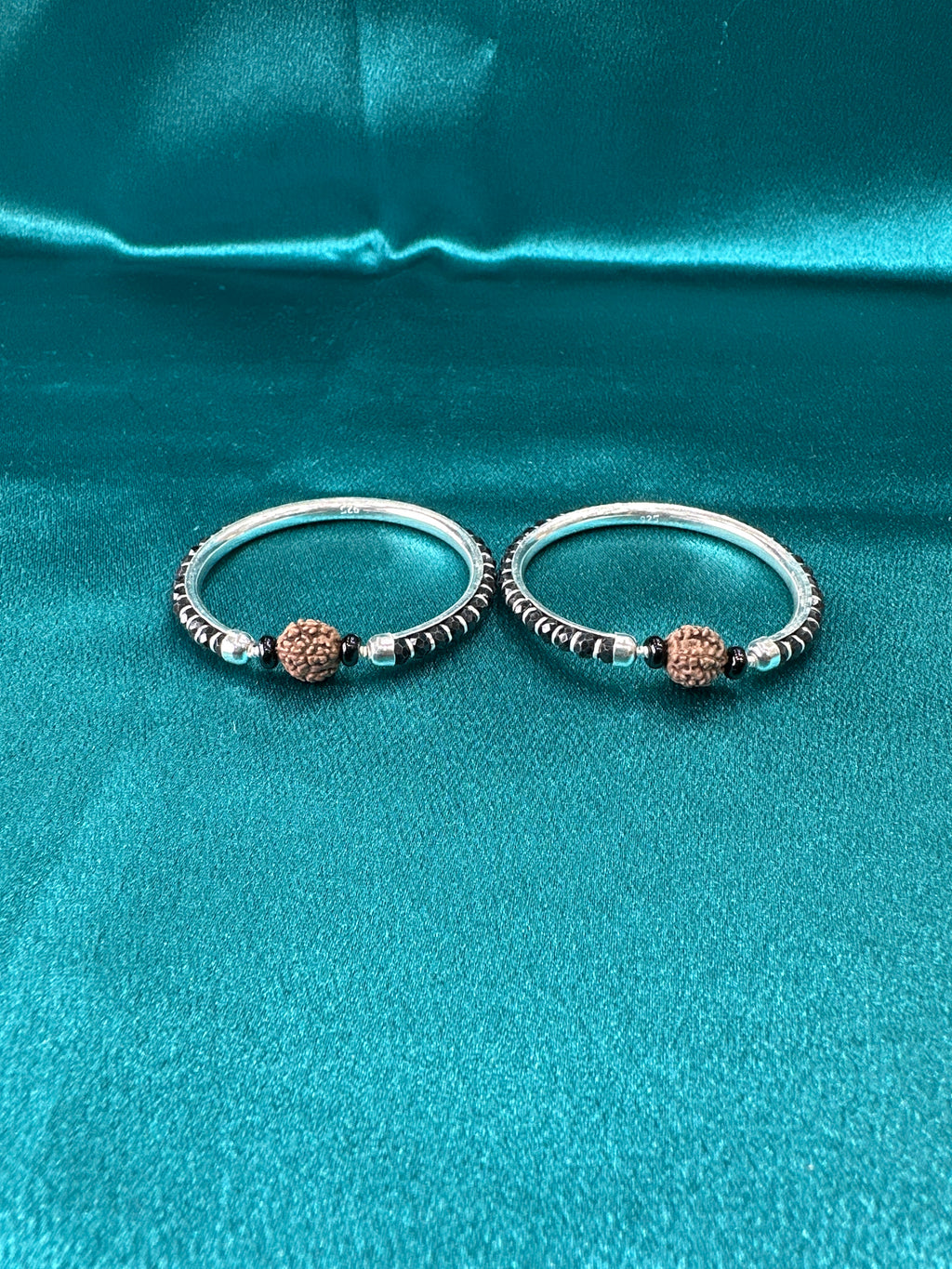 Silver baby bangles with black beads