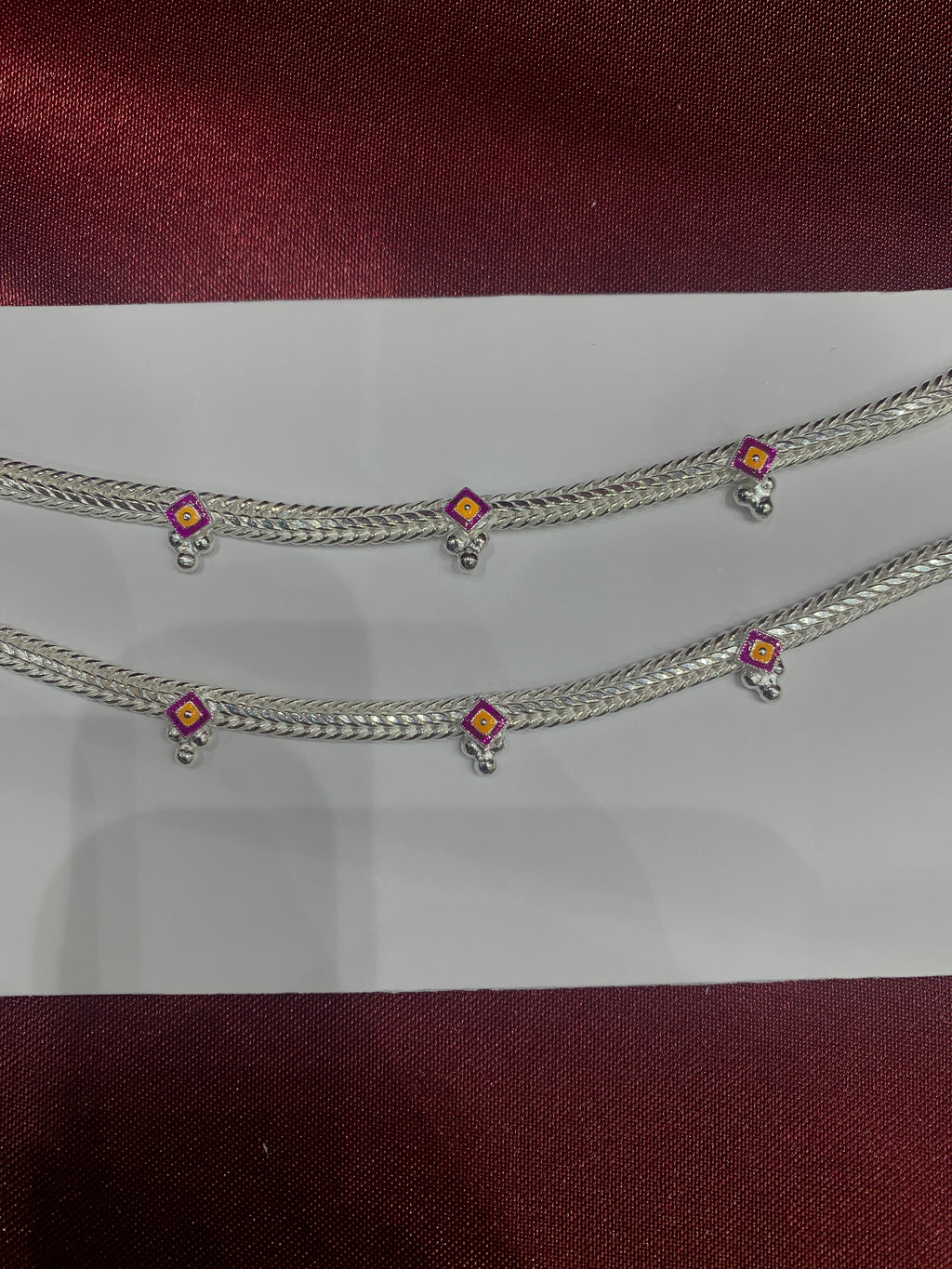 Fancy kids silver anklets in pink and yellow colour enamel (Size: 1-2 year old)