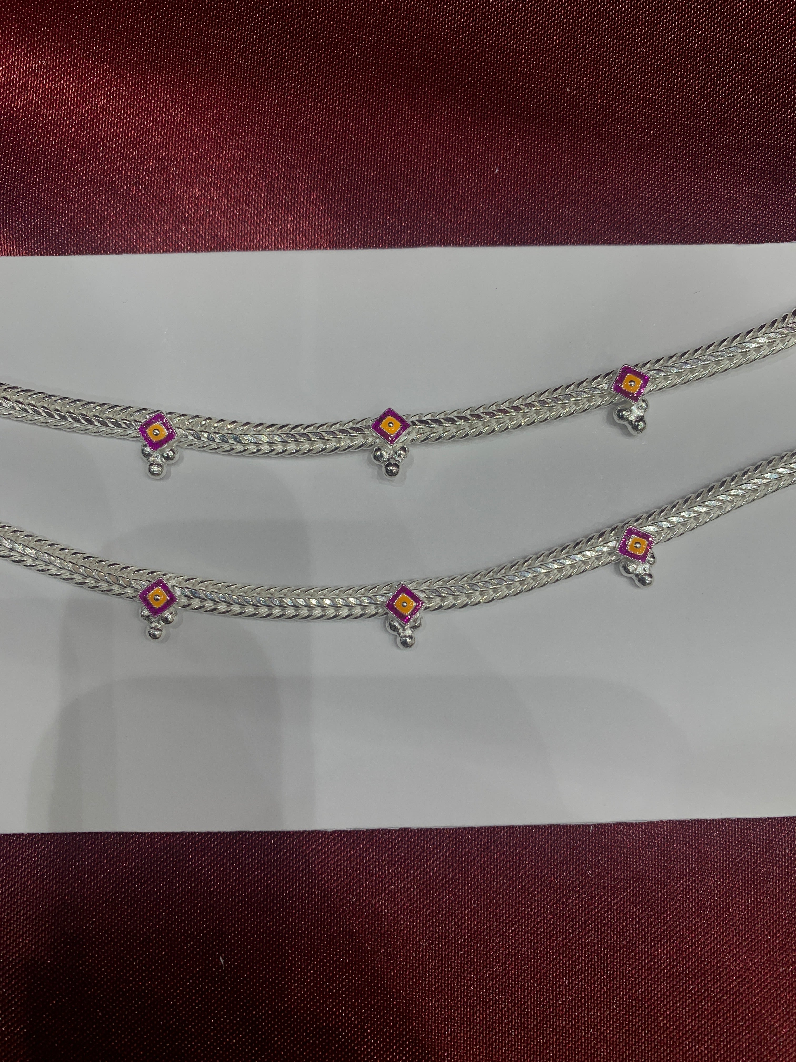 Fancy kids silver anklets in pink and yellow colour enamel (Size: 1-2 year old)