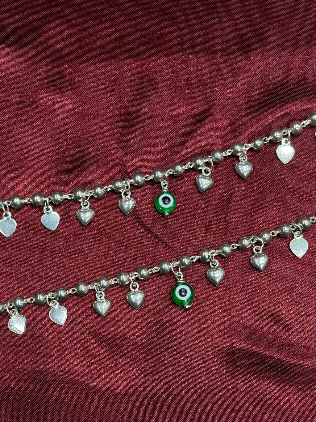 Kids fancy silver anklets with hanging heart charms and green evil eye (6-9 year old)
