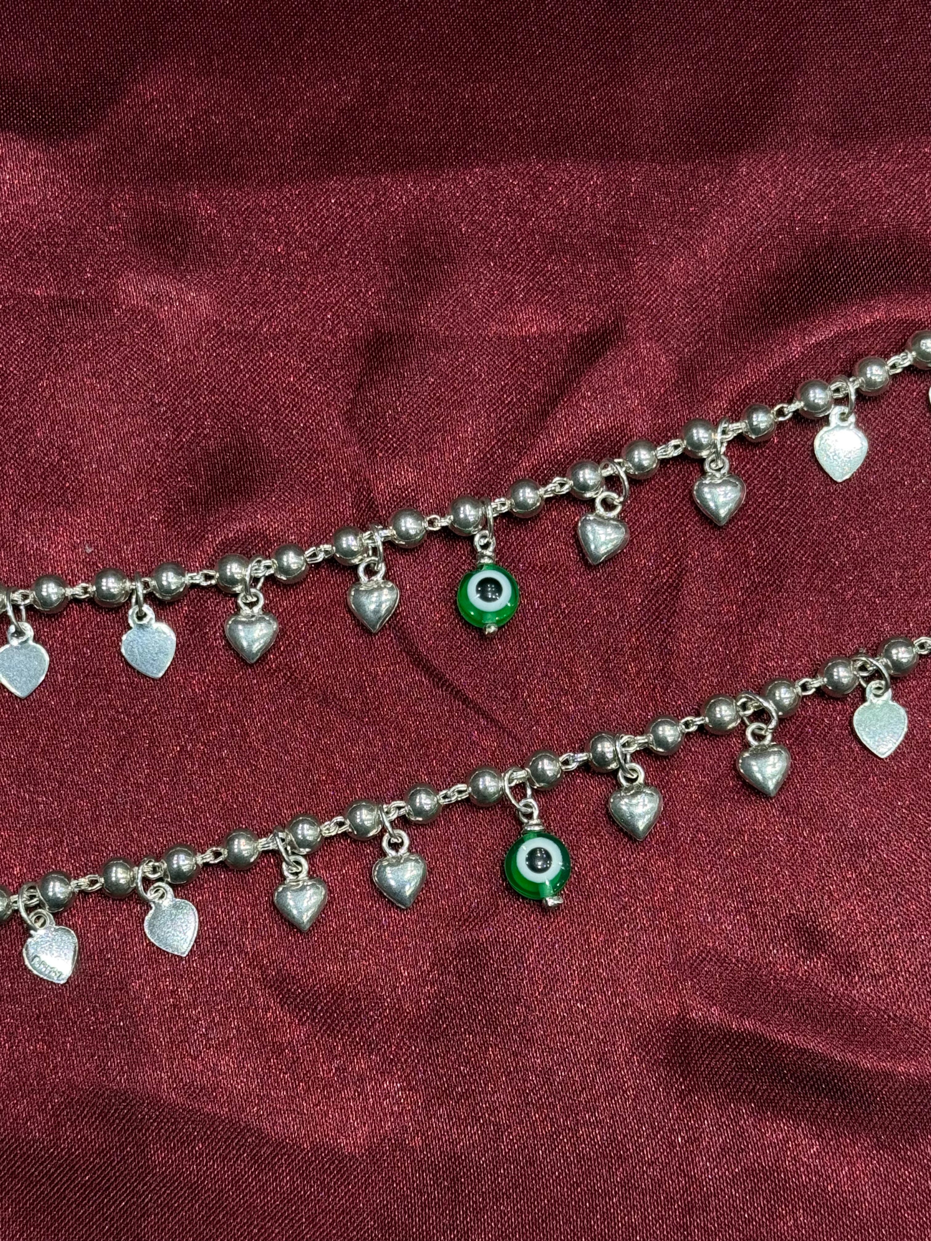 Kids fancy silver anklets with hanging heart charms and green evil eye (6-9 year old)
