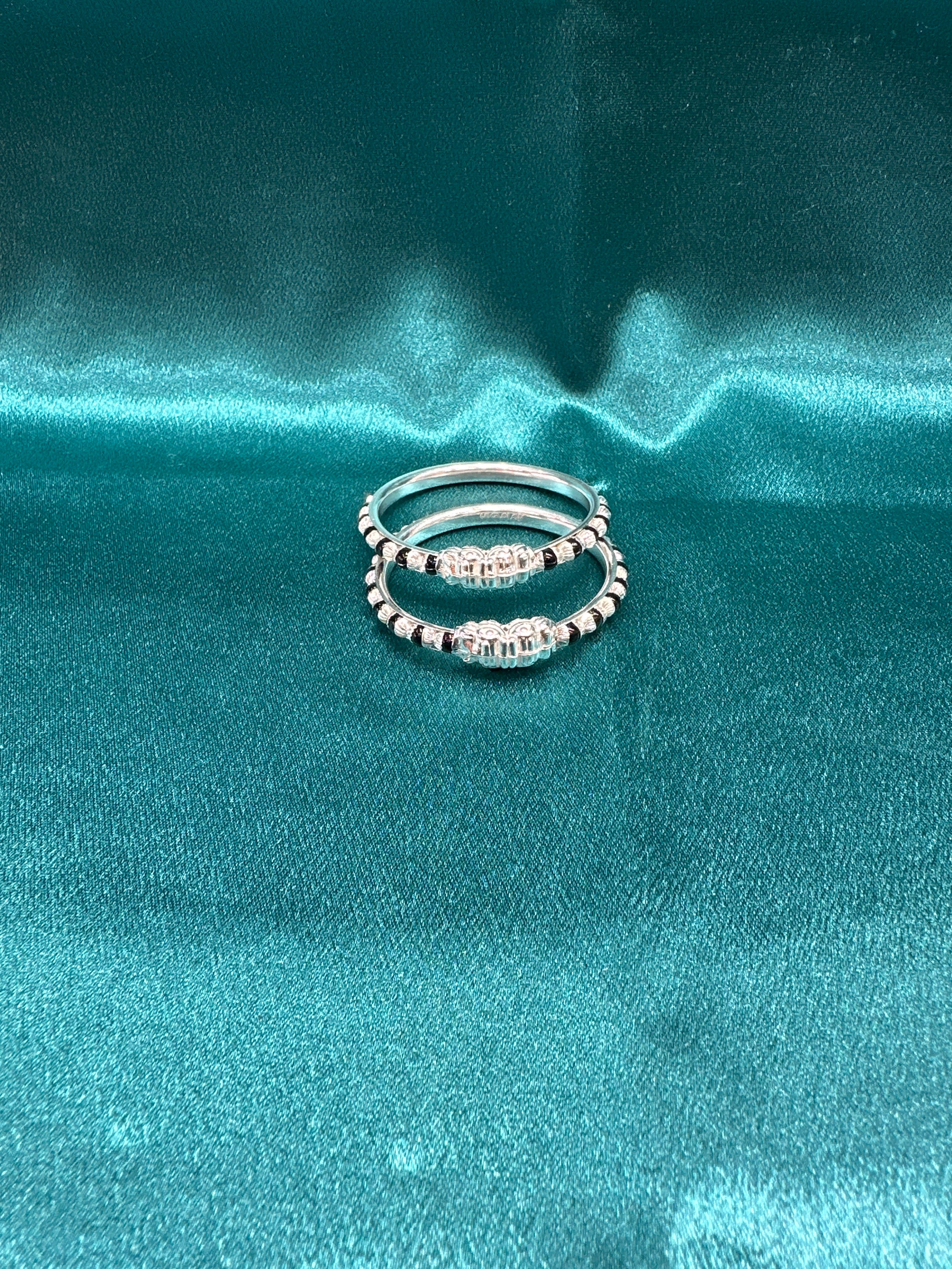 Silver baby bangles with black beads