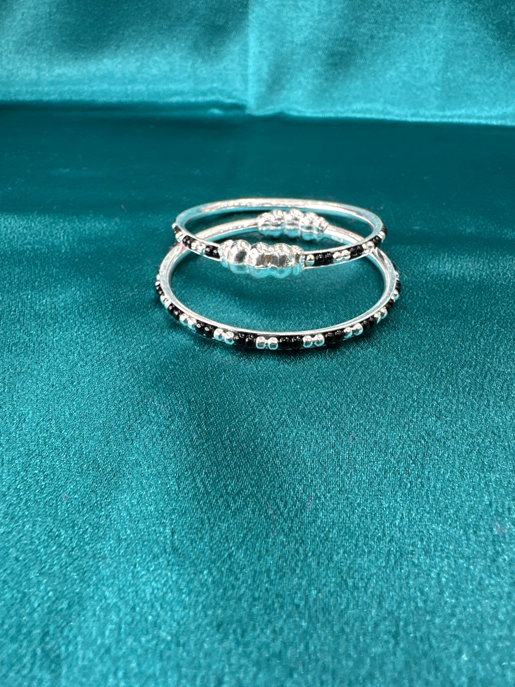Silver baby bangles with black beads