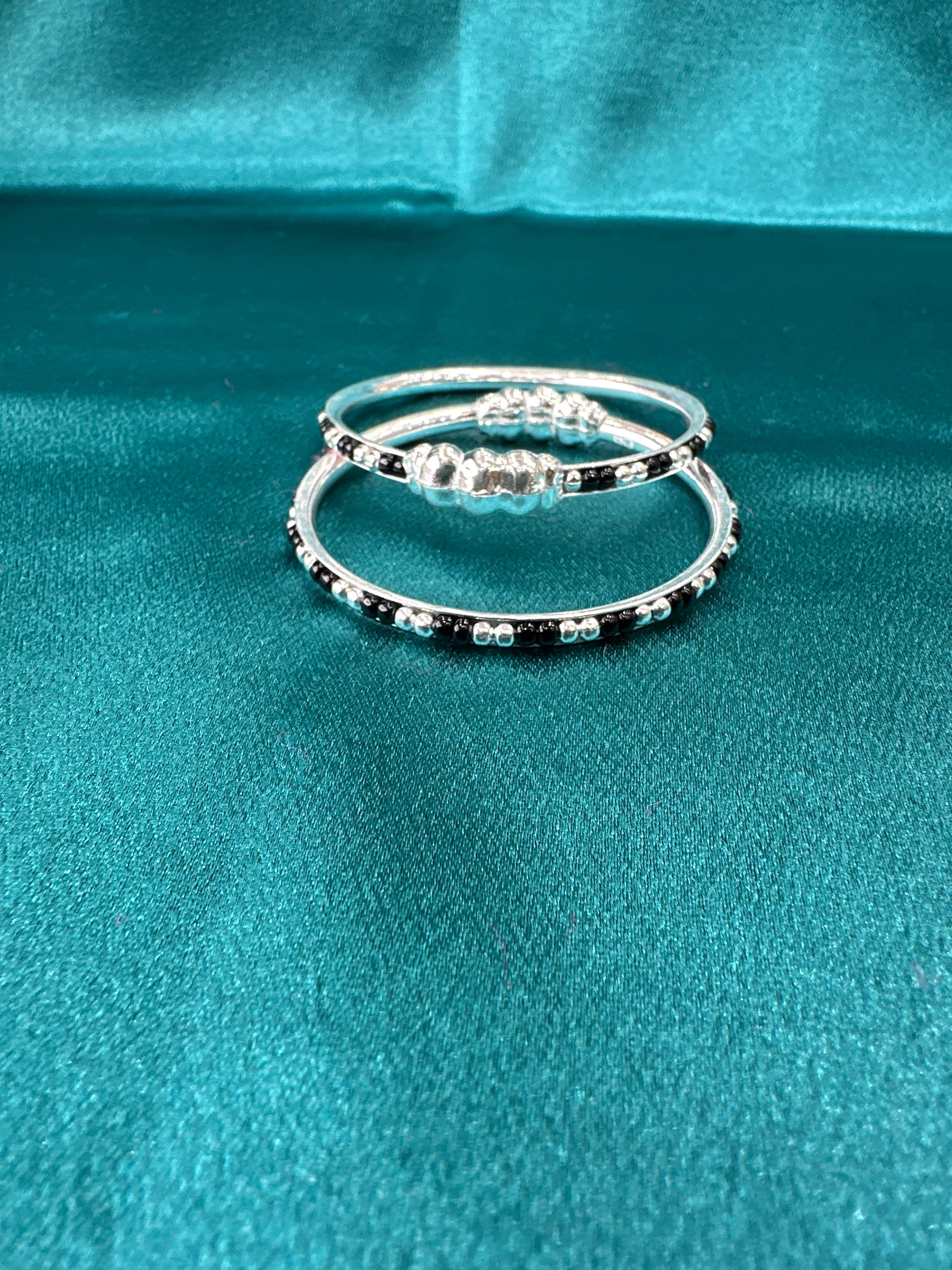Silver baby bangles with black beads