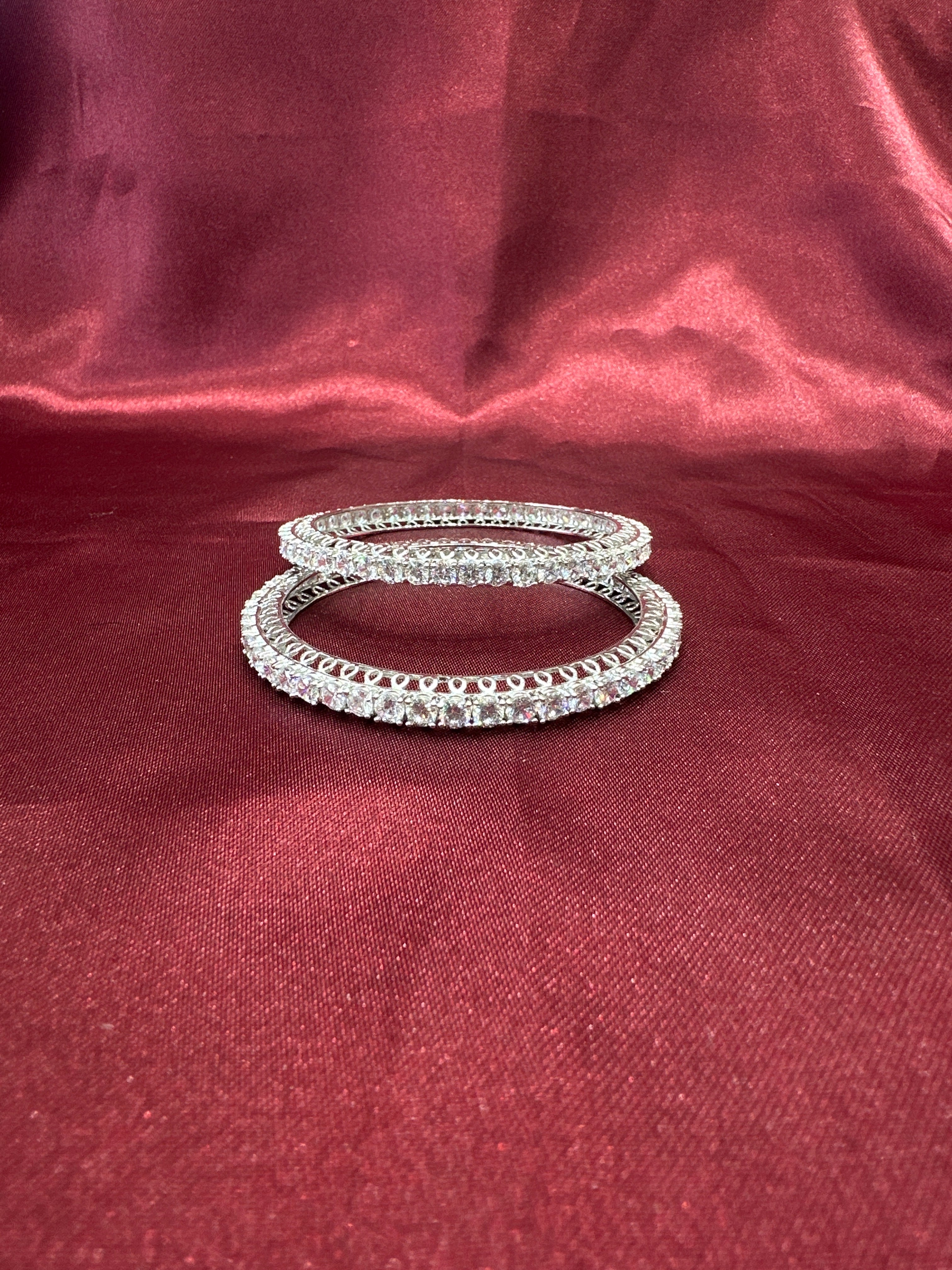 Elegant CZ diamond silver bangles with white stone in sequence design