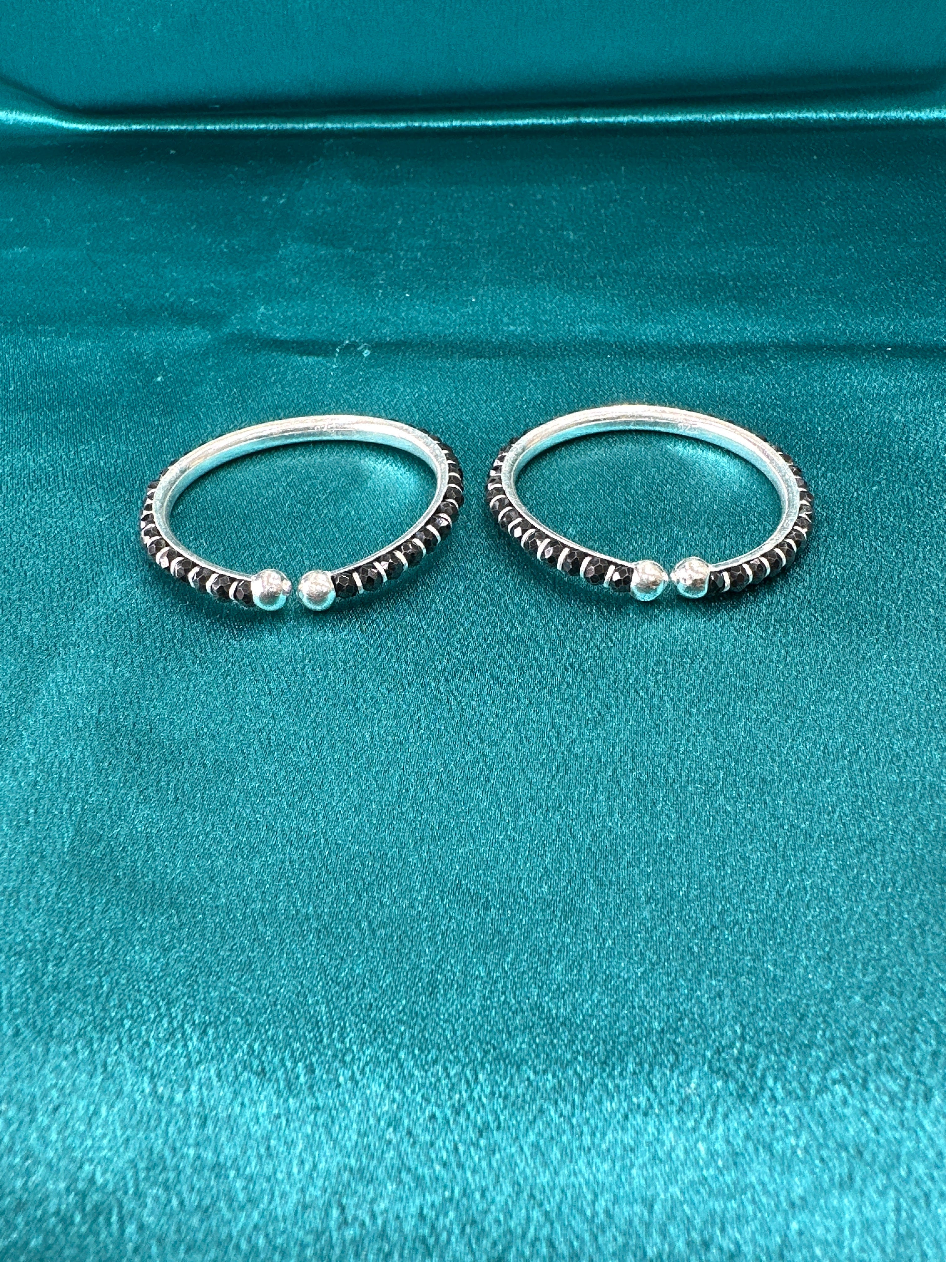 Silver baby bangles with black beads