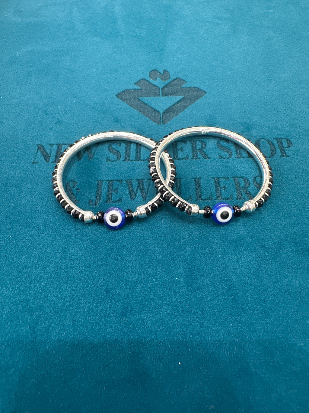 Silver baby bangles with black beads