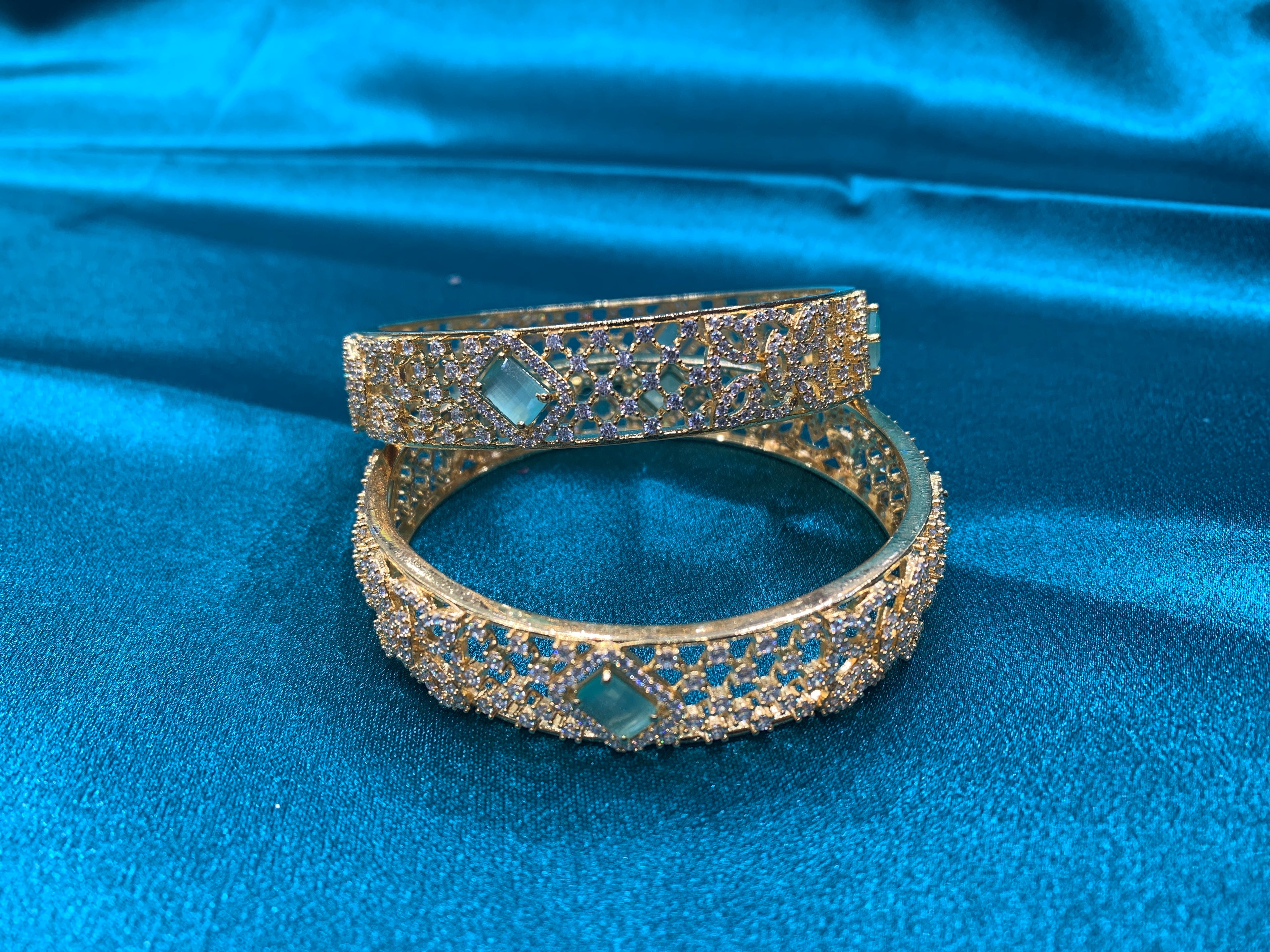 Dazzling Gold plated silver bangles with green CZ diamonds