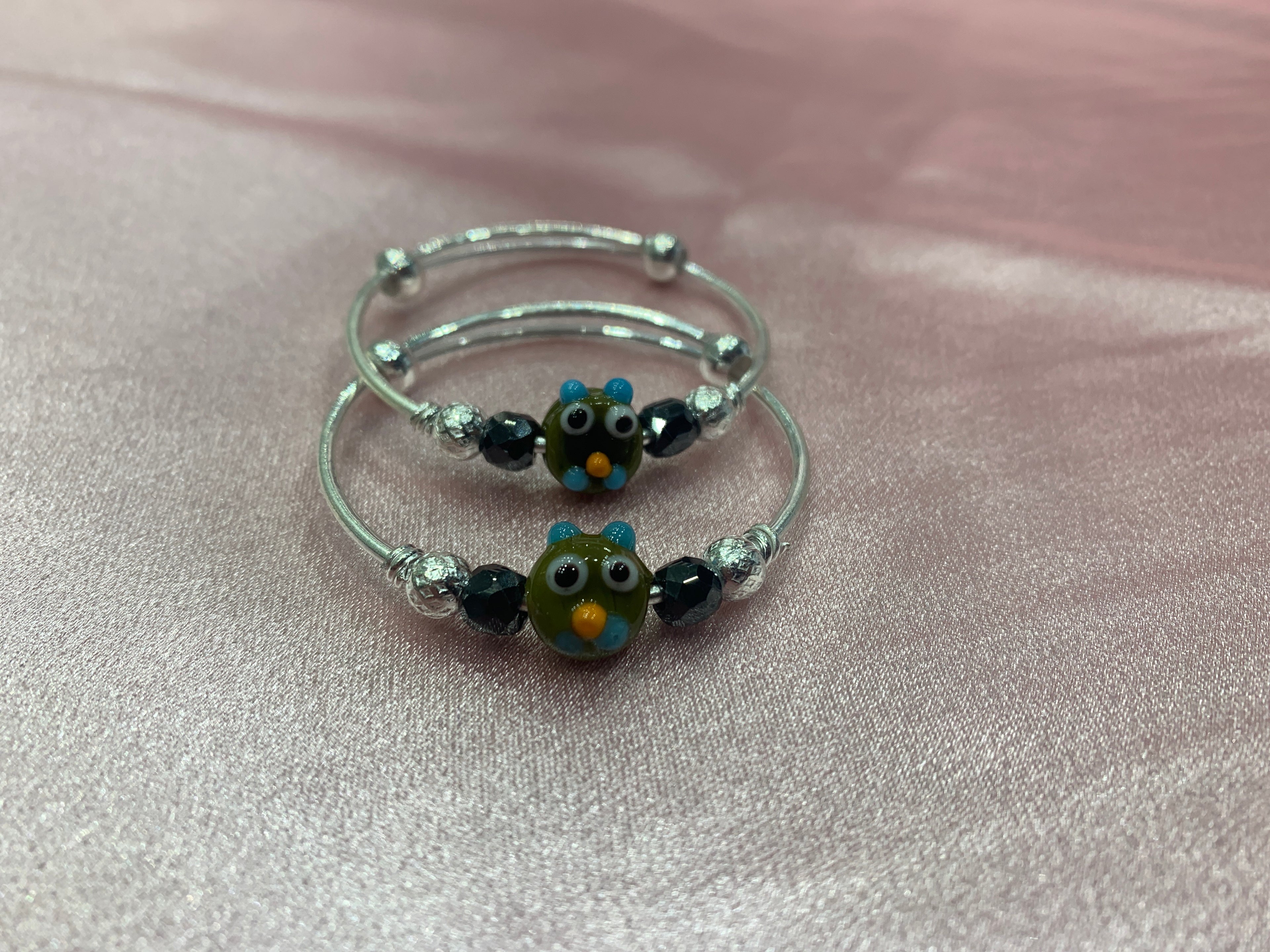 Silver baby bangles with black beads and angry bird