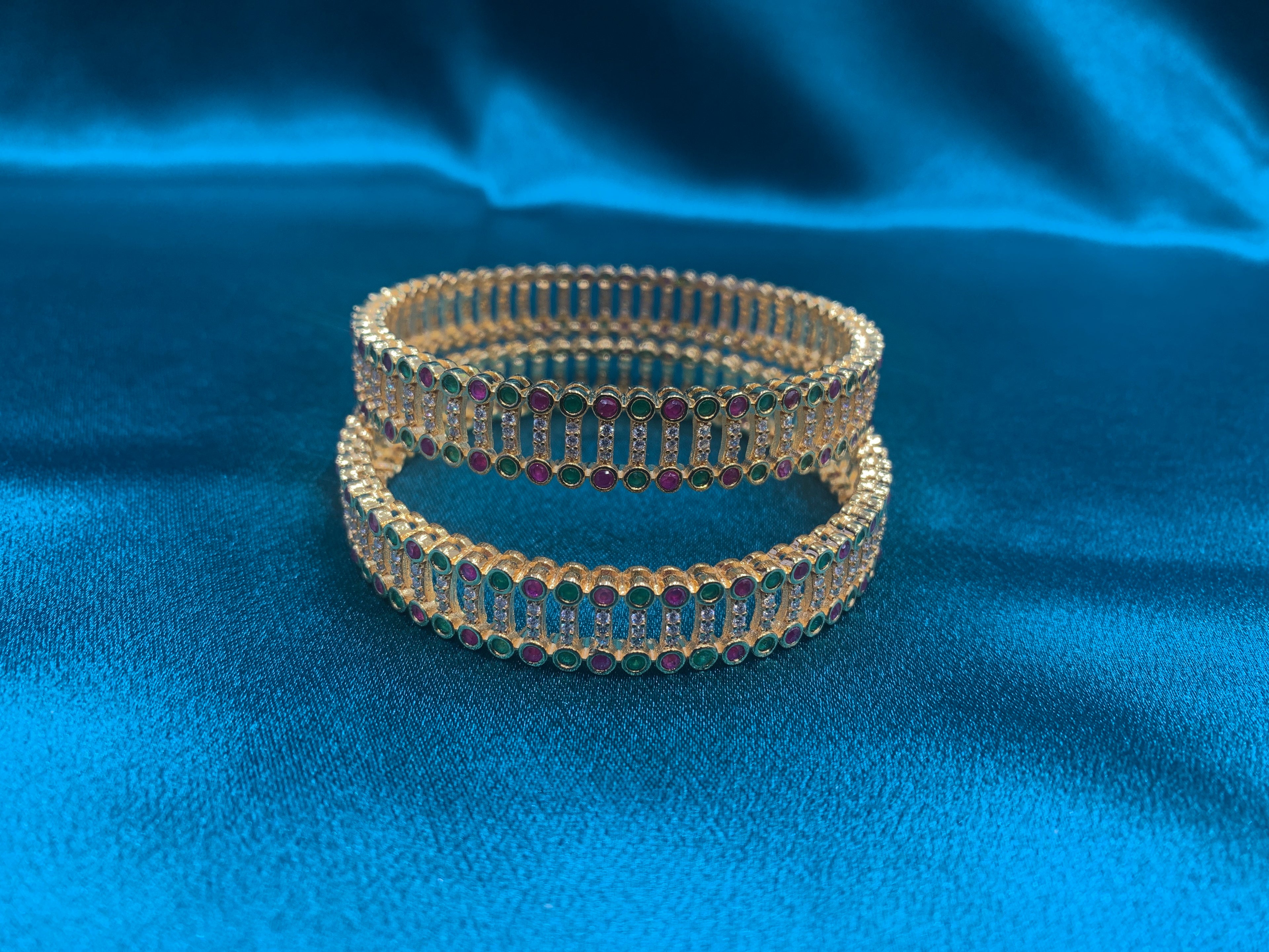 Dazzling gold plated silver bangles with green and pink CZ diamonds