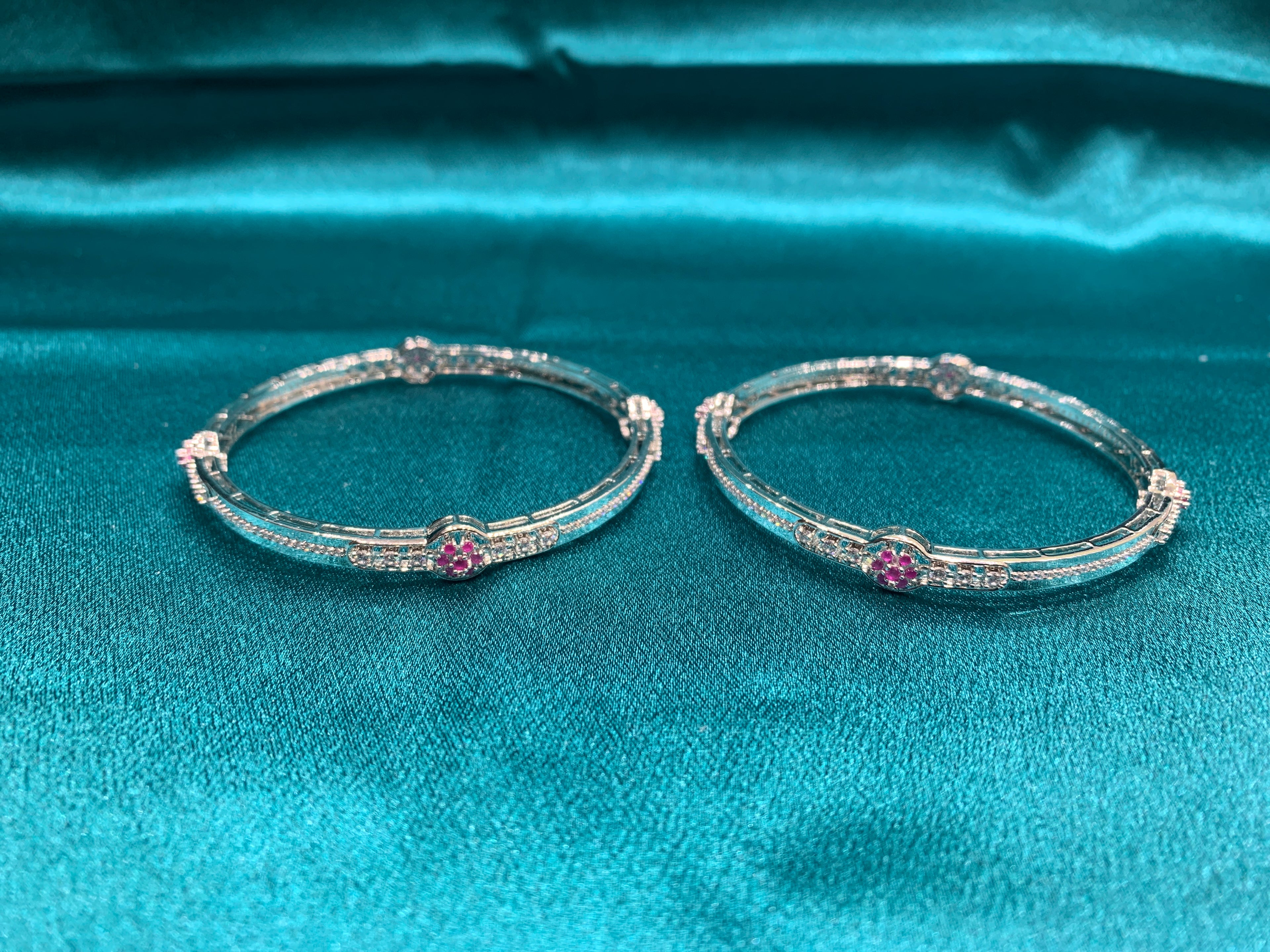 Elegant CZ diamond silver bangles with pink stones in flower pattern
