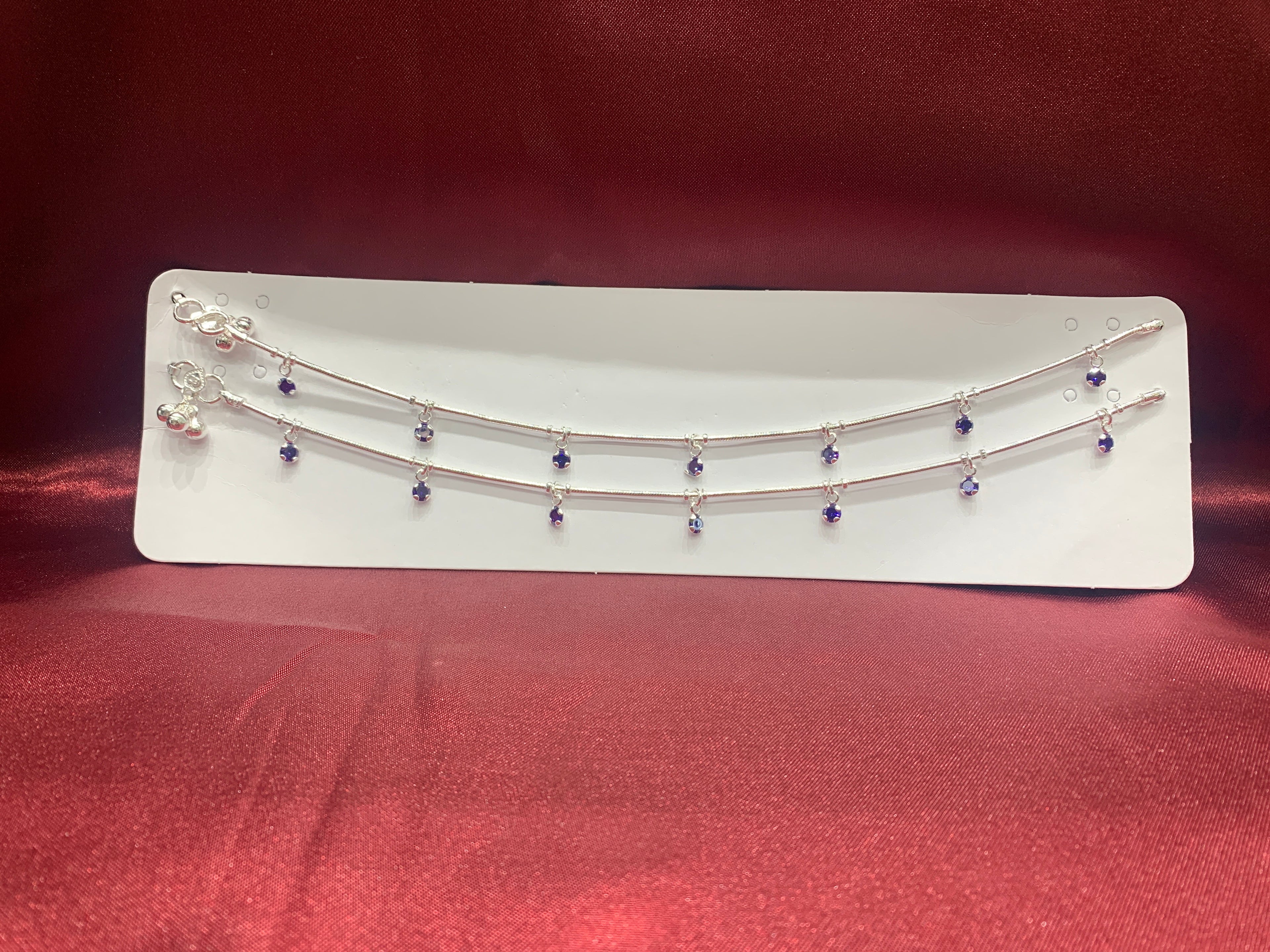 Fancy silver anklets with purple hanging CZ diamonds