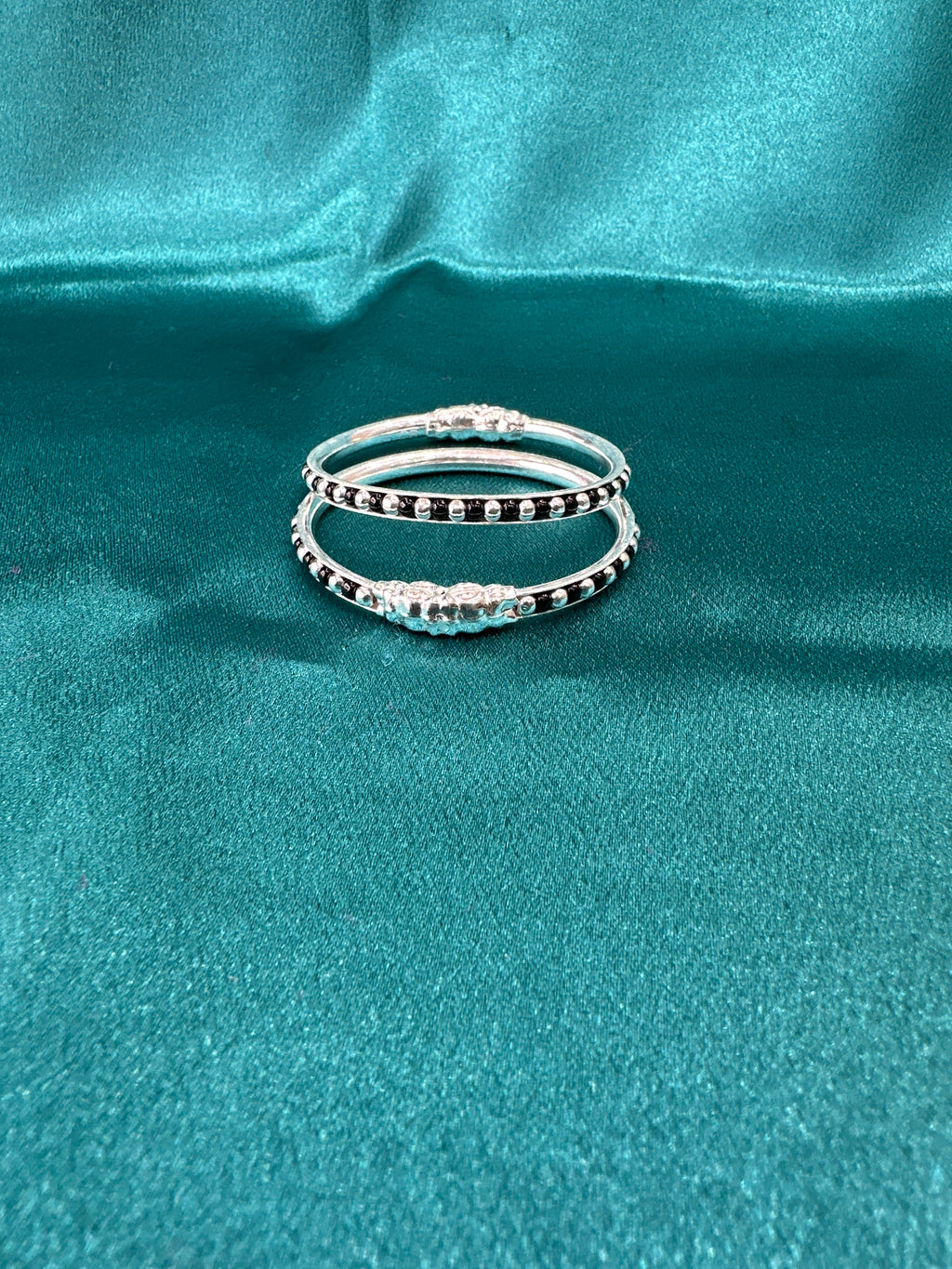 Silver baby bangles with black beads