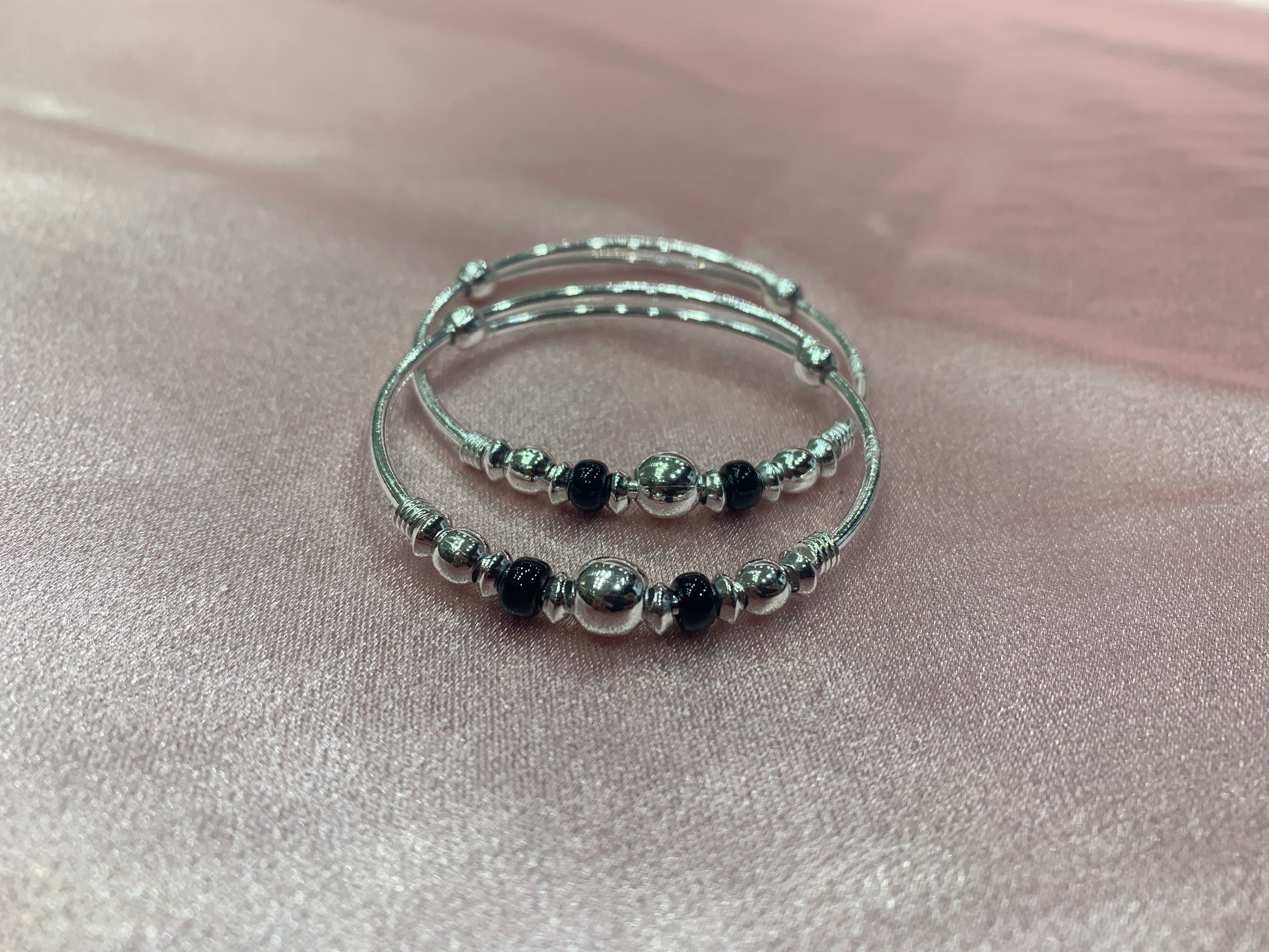 Silver baby bangles with black and silver beads