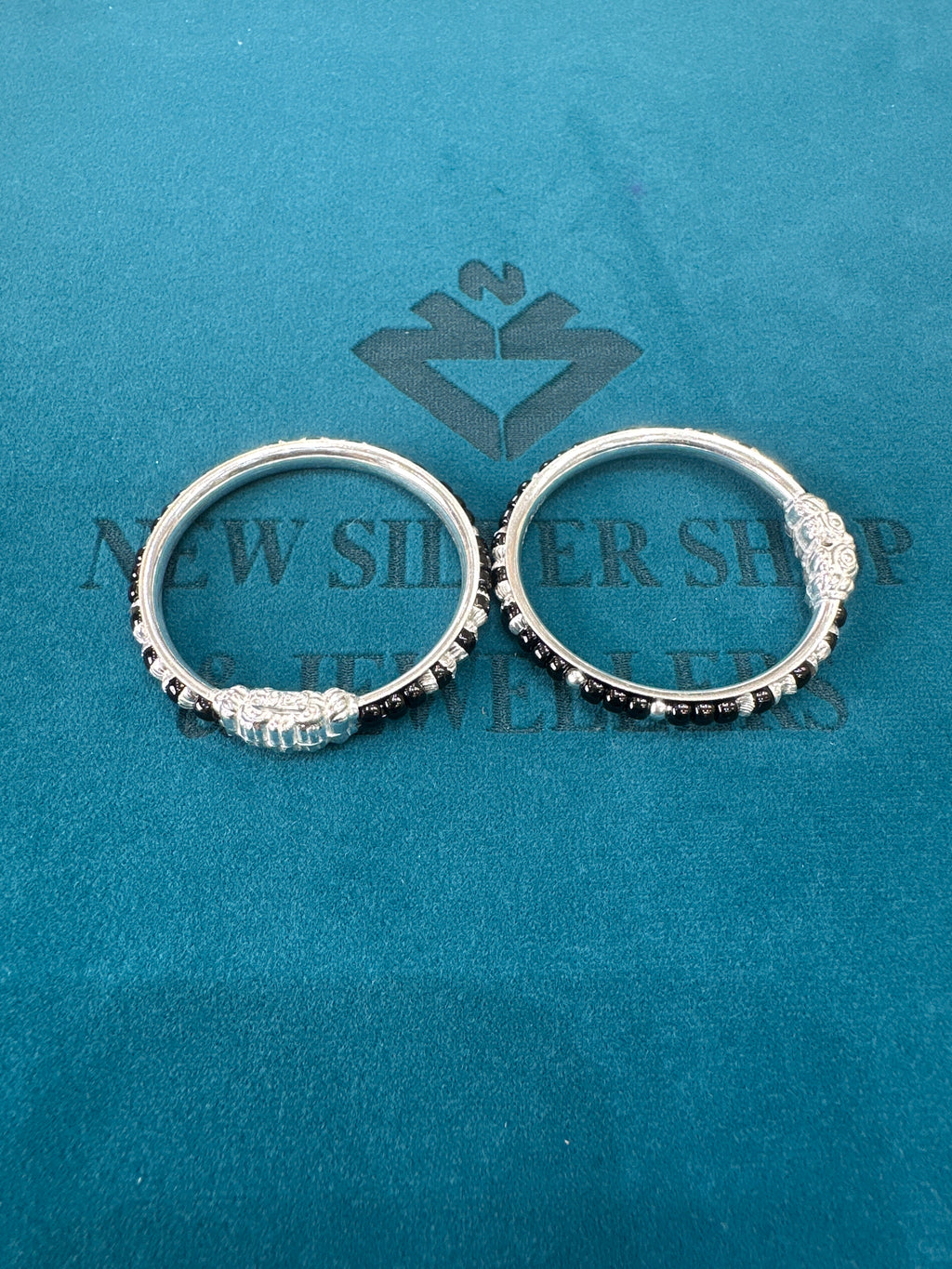 Silver baby bangles with black beads