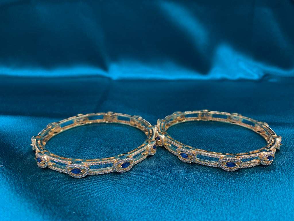Dazzling gold plated silver bangles with blue stones and white CZ diamonds