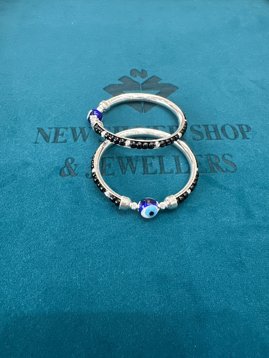 Silver baby bangles with black beads