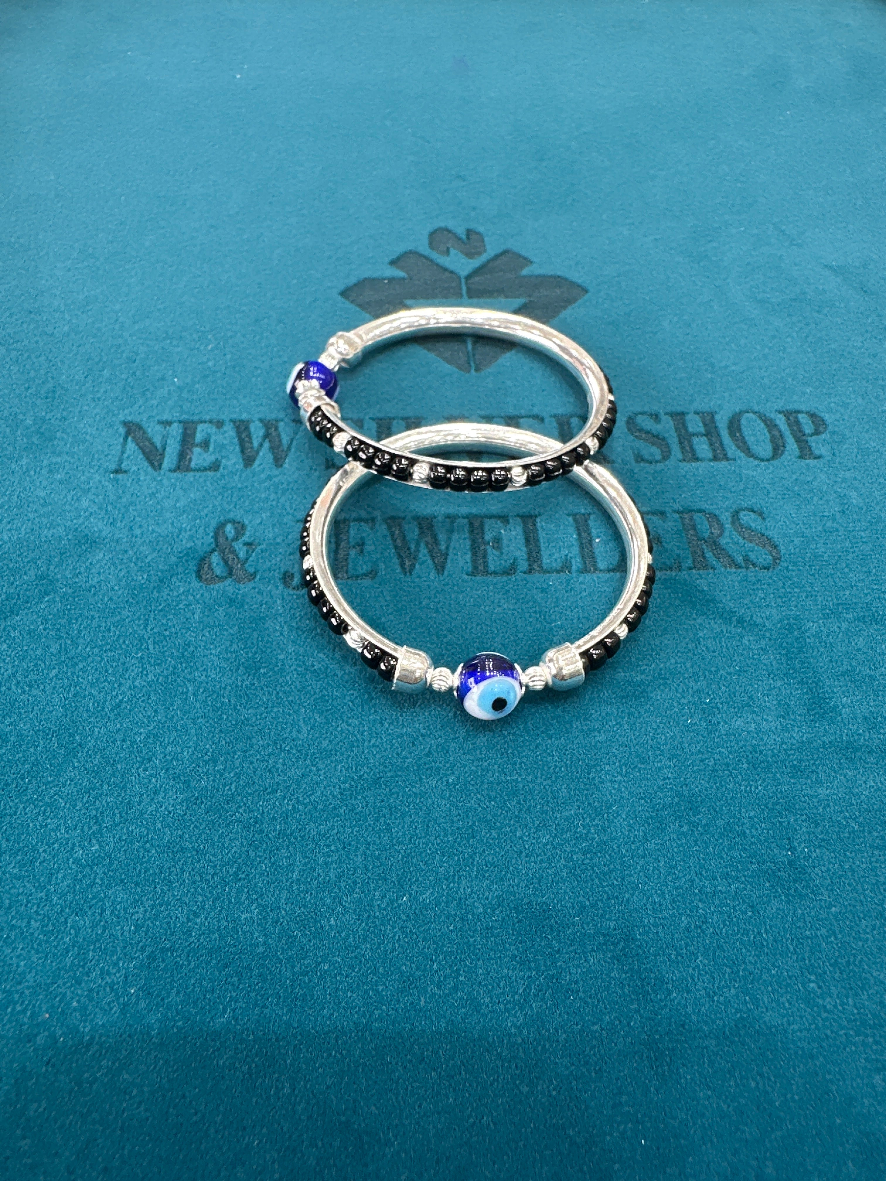 Silver baby bangles with black beads
