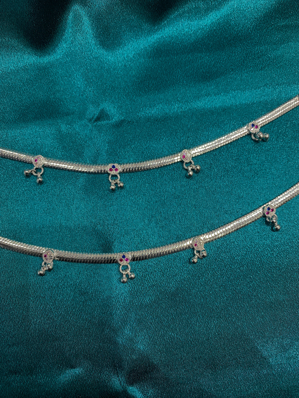 Traditional silver anklets with blue and pink CZ diamonds and hanging bells
