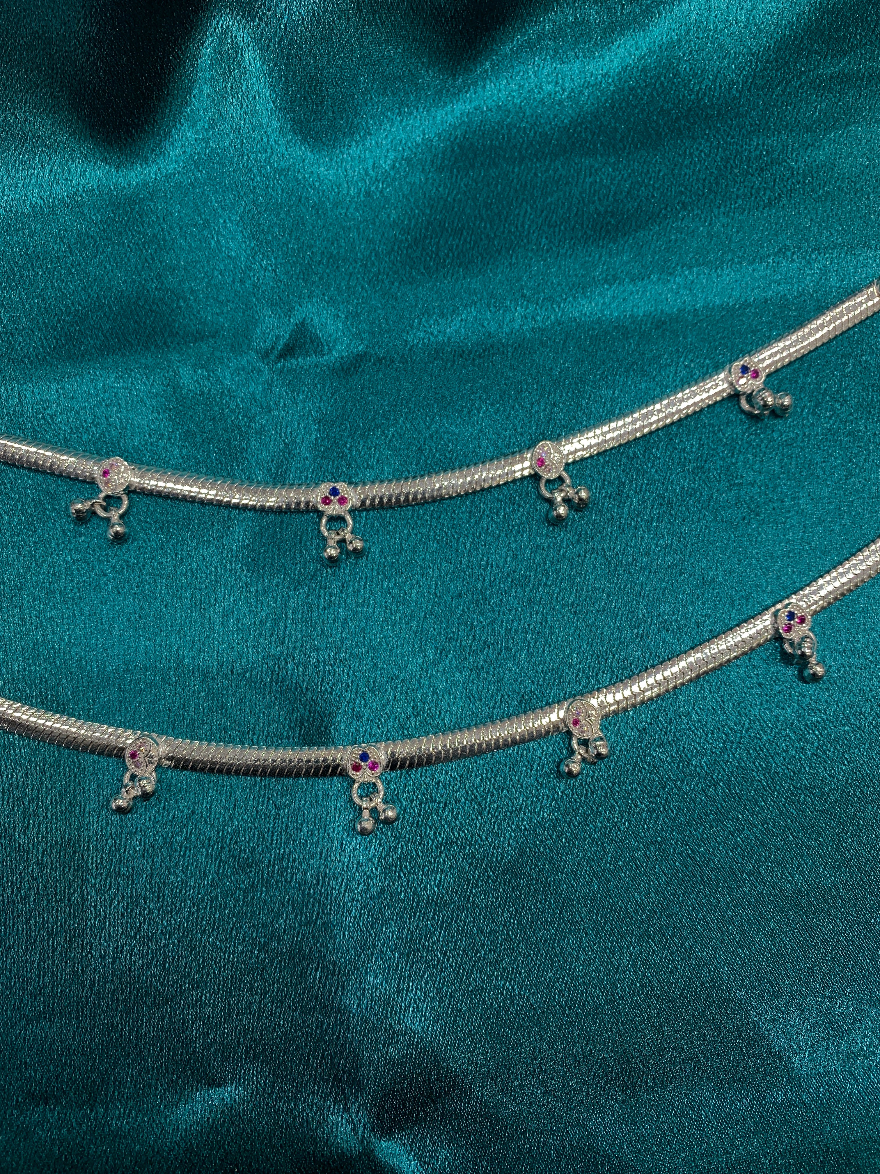Traditional silver anklets with blue and pink CZ diamonds and hanging bells