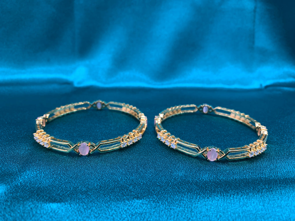 Dazzling gold plated silver bangles with peach CZ diamonds