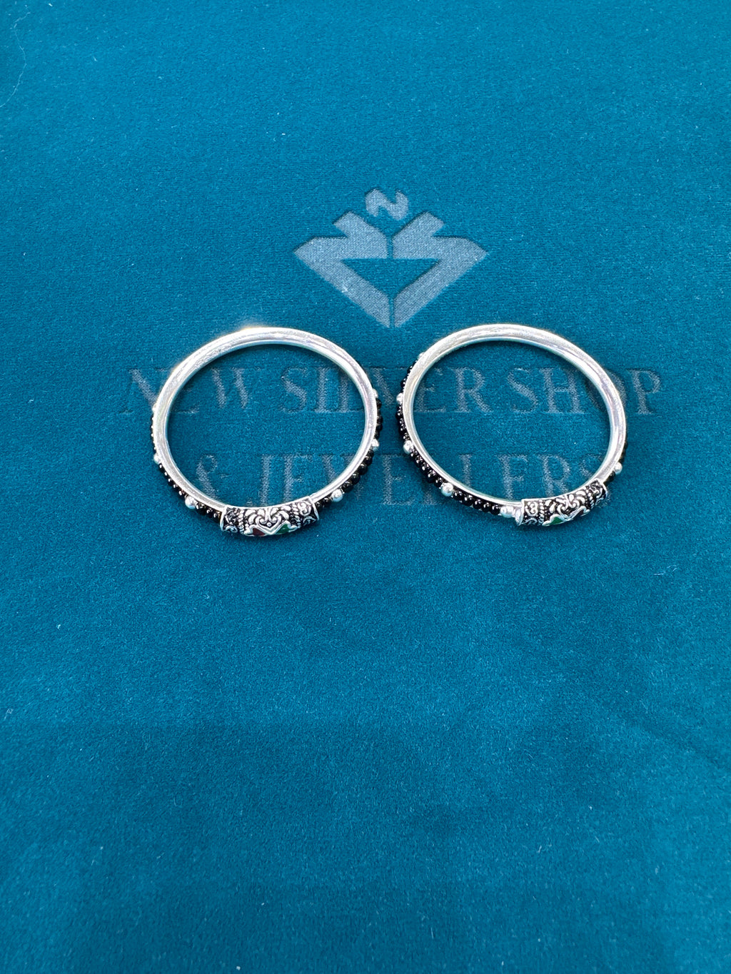 Silver baby bangles with black beads
