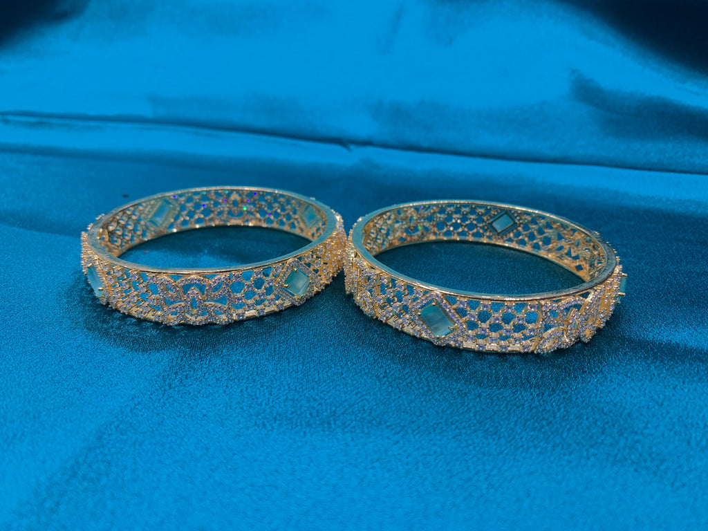 Dazzling Gold plated silver bangles with green CZ diamonds