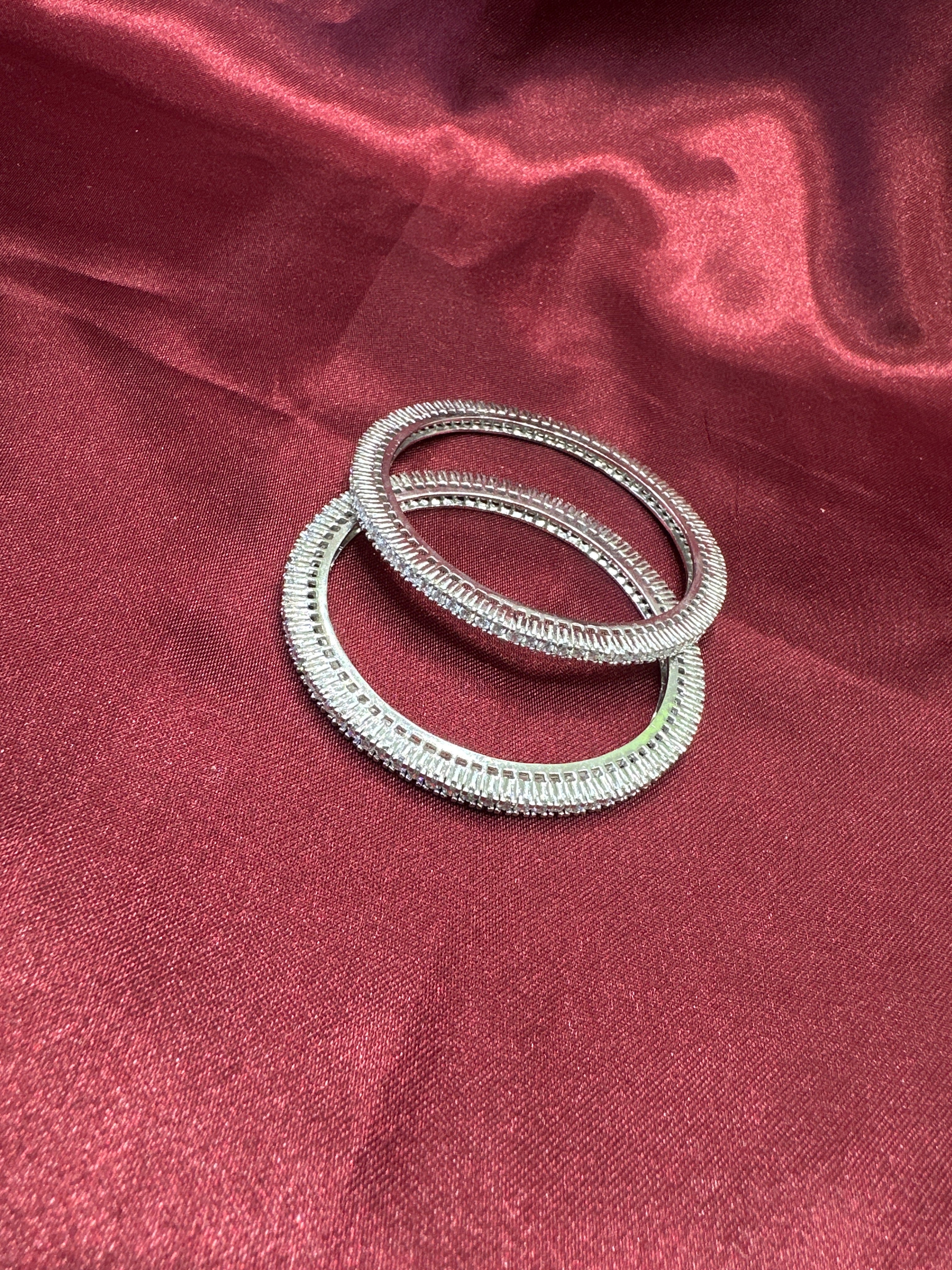 Elegant CZ diamond silver bangles with white stone in sequence design
