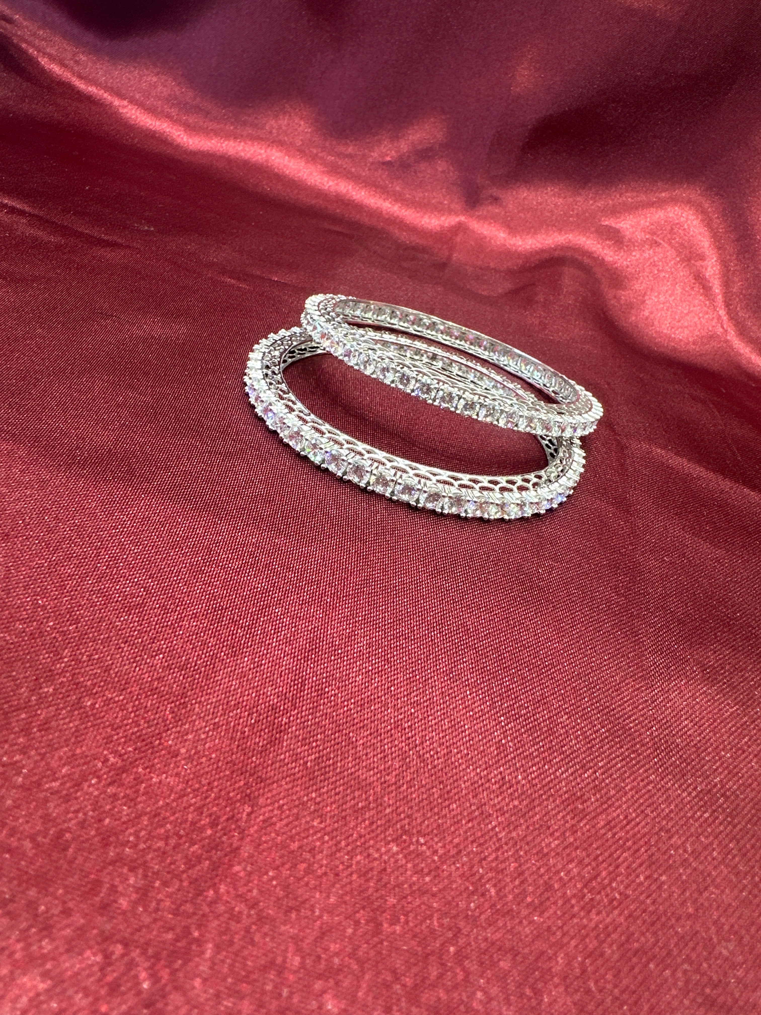 Elegant CZ diamond silver bangles with white stone in sequence design