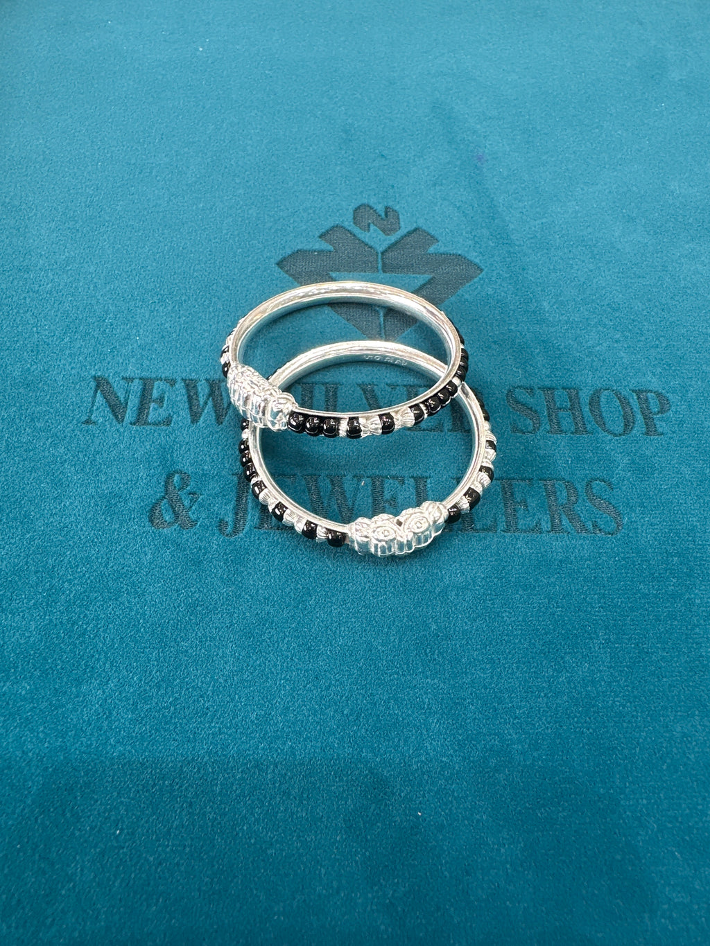 Silver baby bangles with black beads