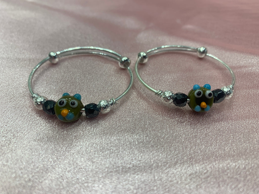 Silver baby bangles with black beads and angry bird