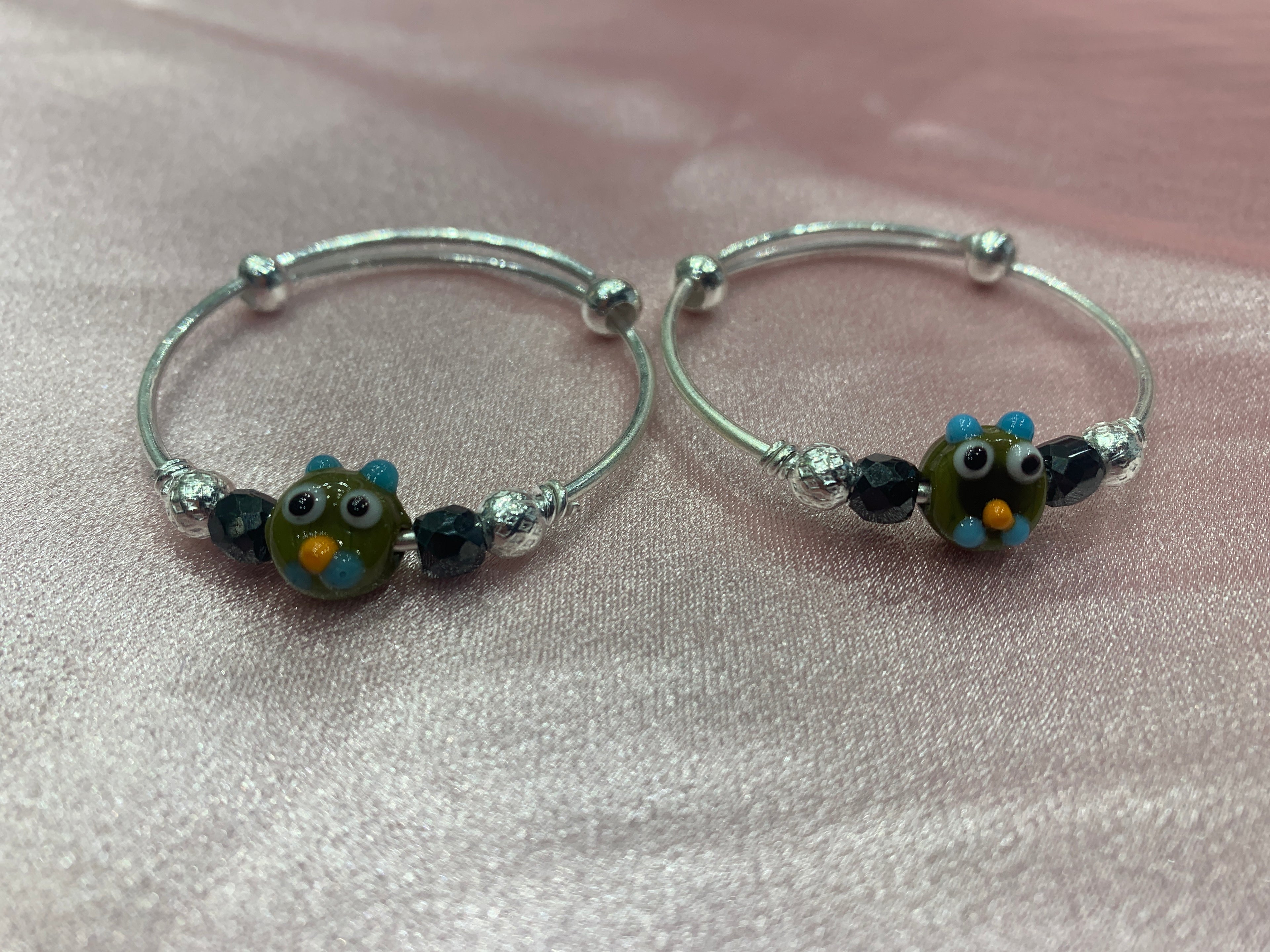 Silver baby bangles with black beads and angry bird