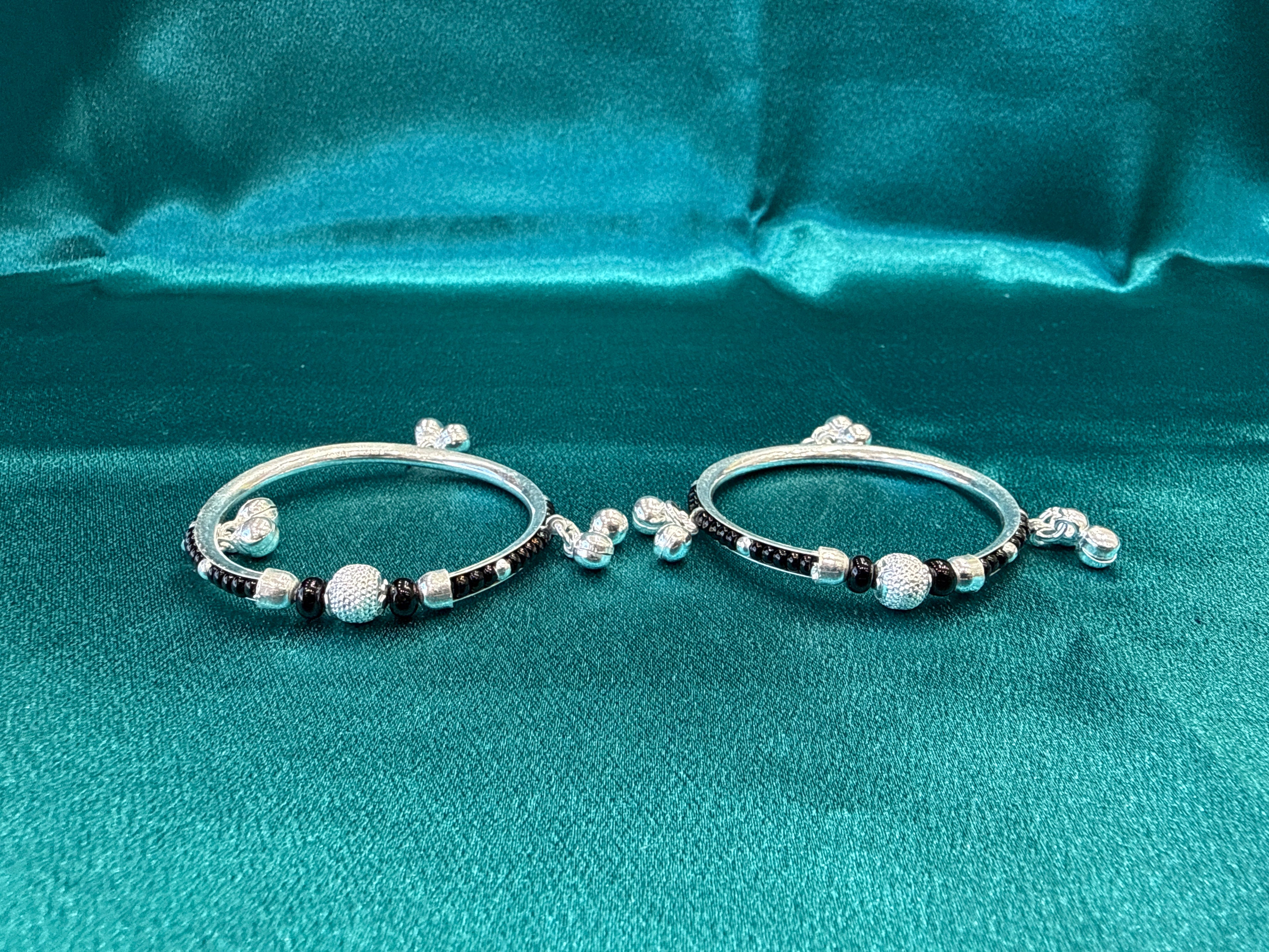 Silver baby bangles with black beads and bells BBB7