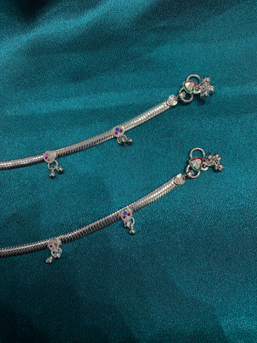 Traditional silver anklets with blue and pink CZ diamonds and hanging bells