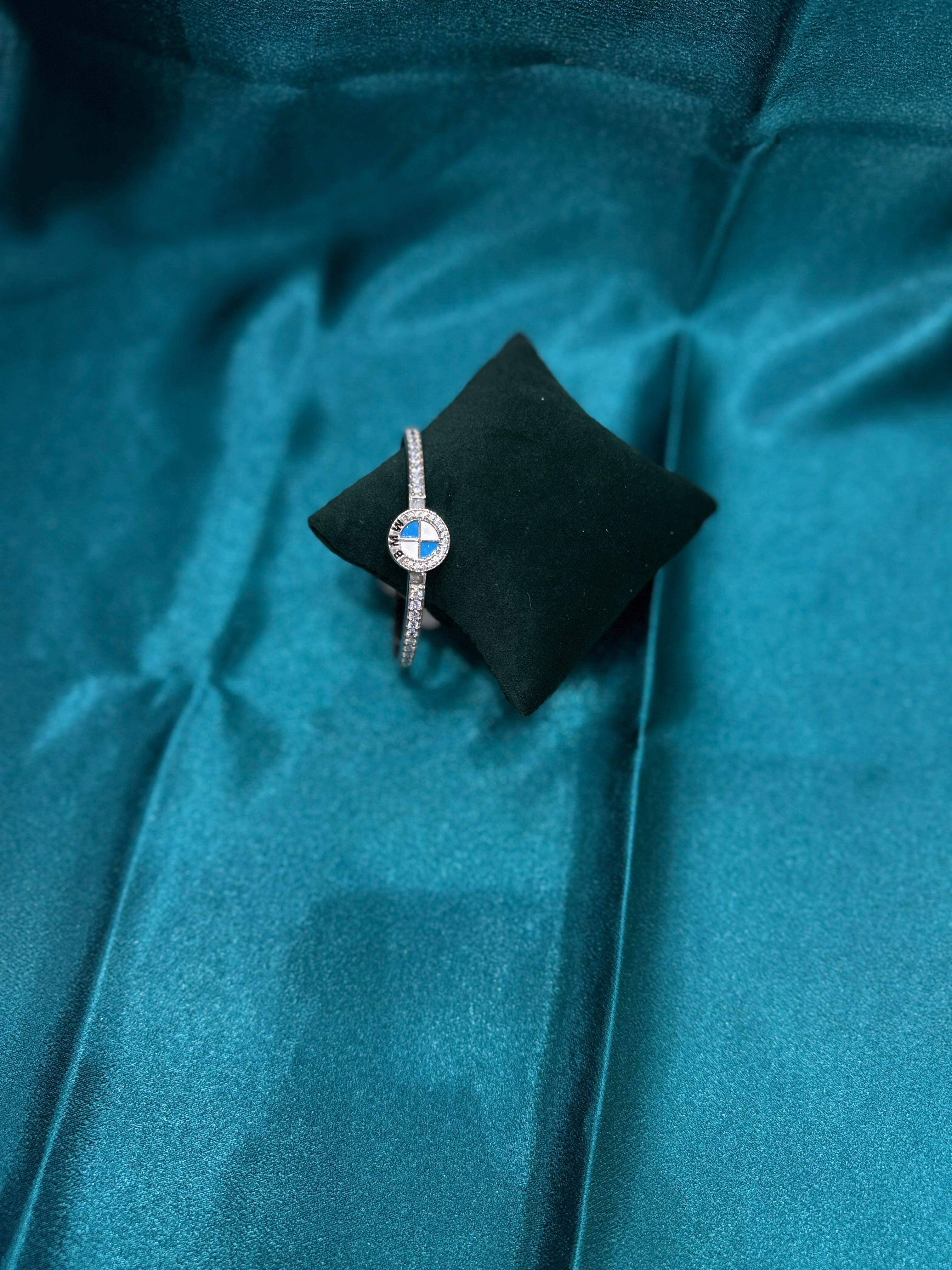 Fancy silver CZ diamond bangle with BMW inspired design