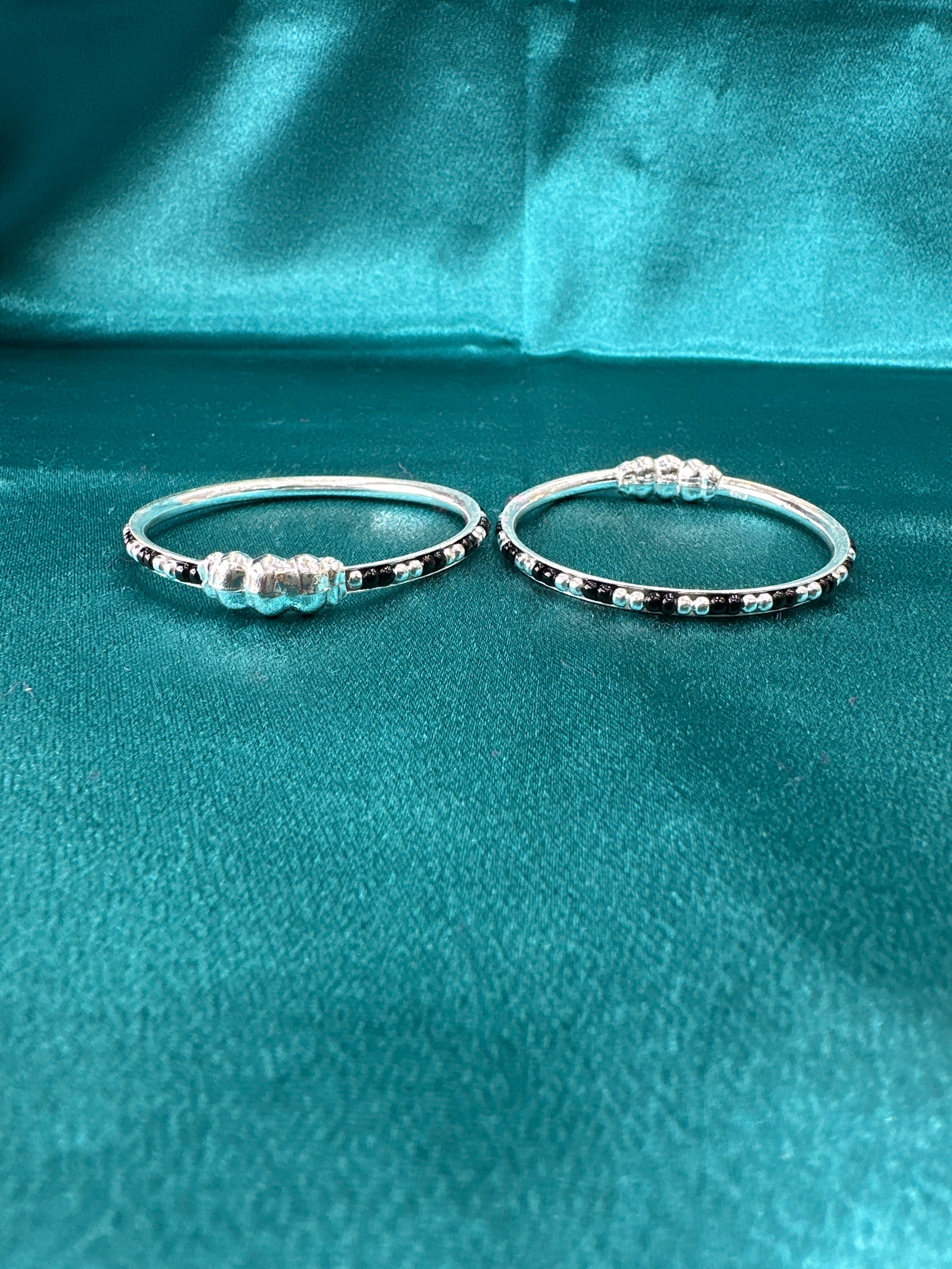 Silver baby bangles with black beads
