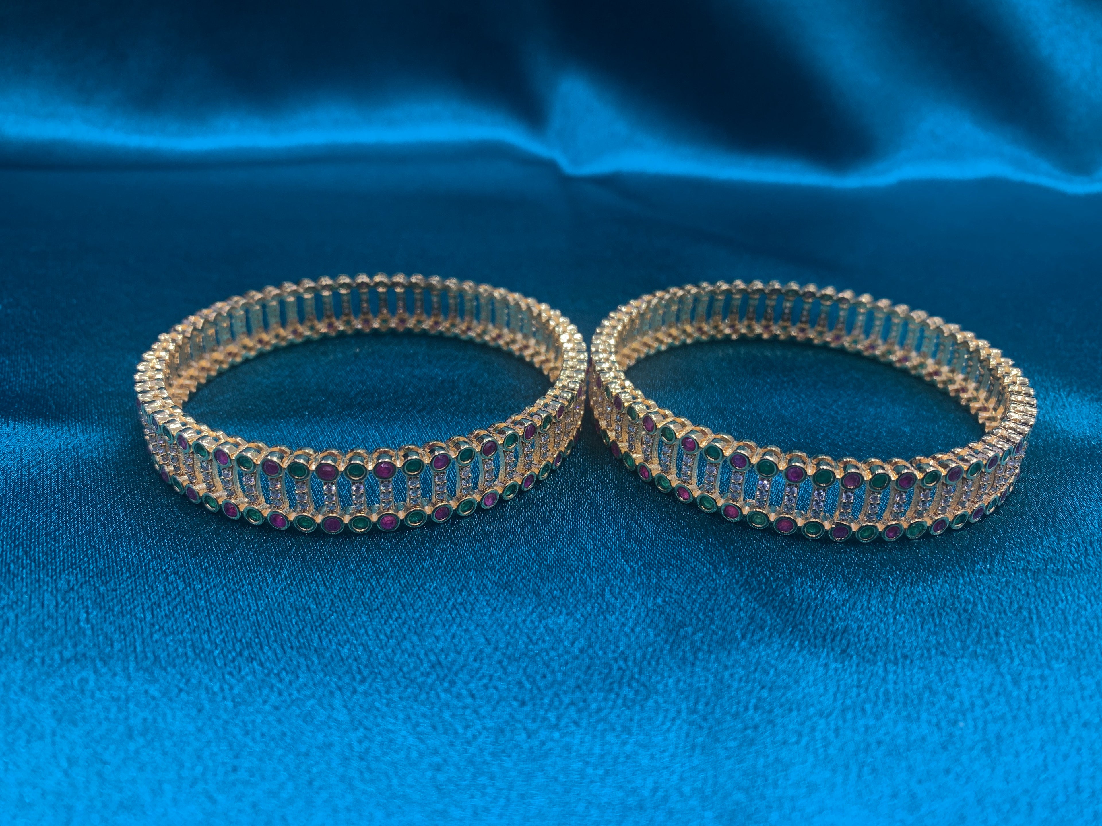 Dazzling gold plated silver bangles with green and pink CZ diamonds