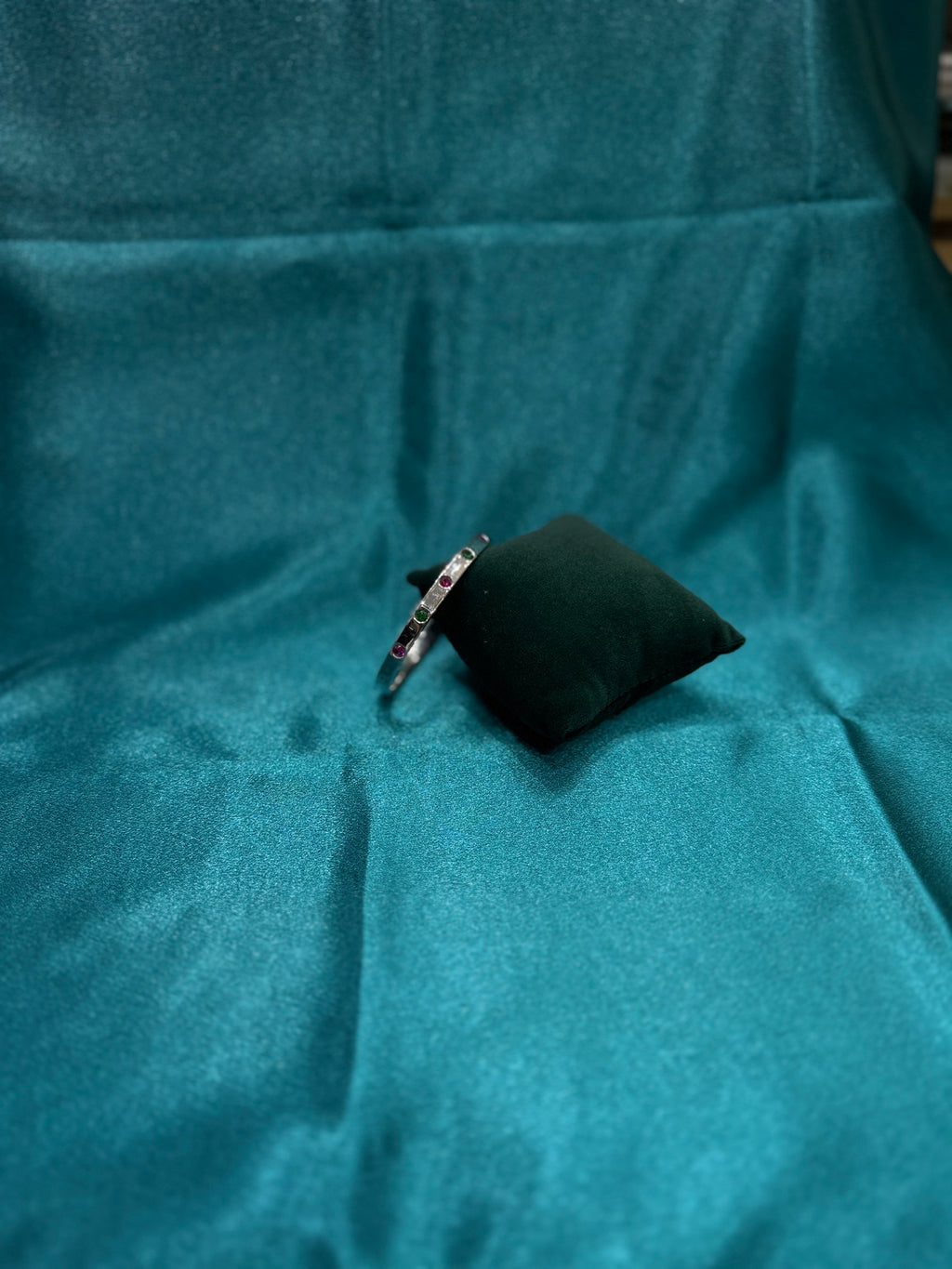 Fancy silver openable bangle with pink and green stone