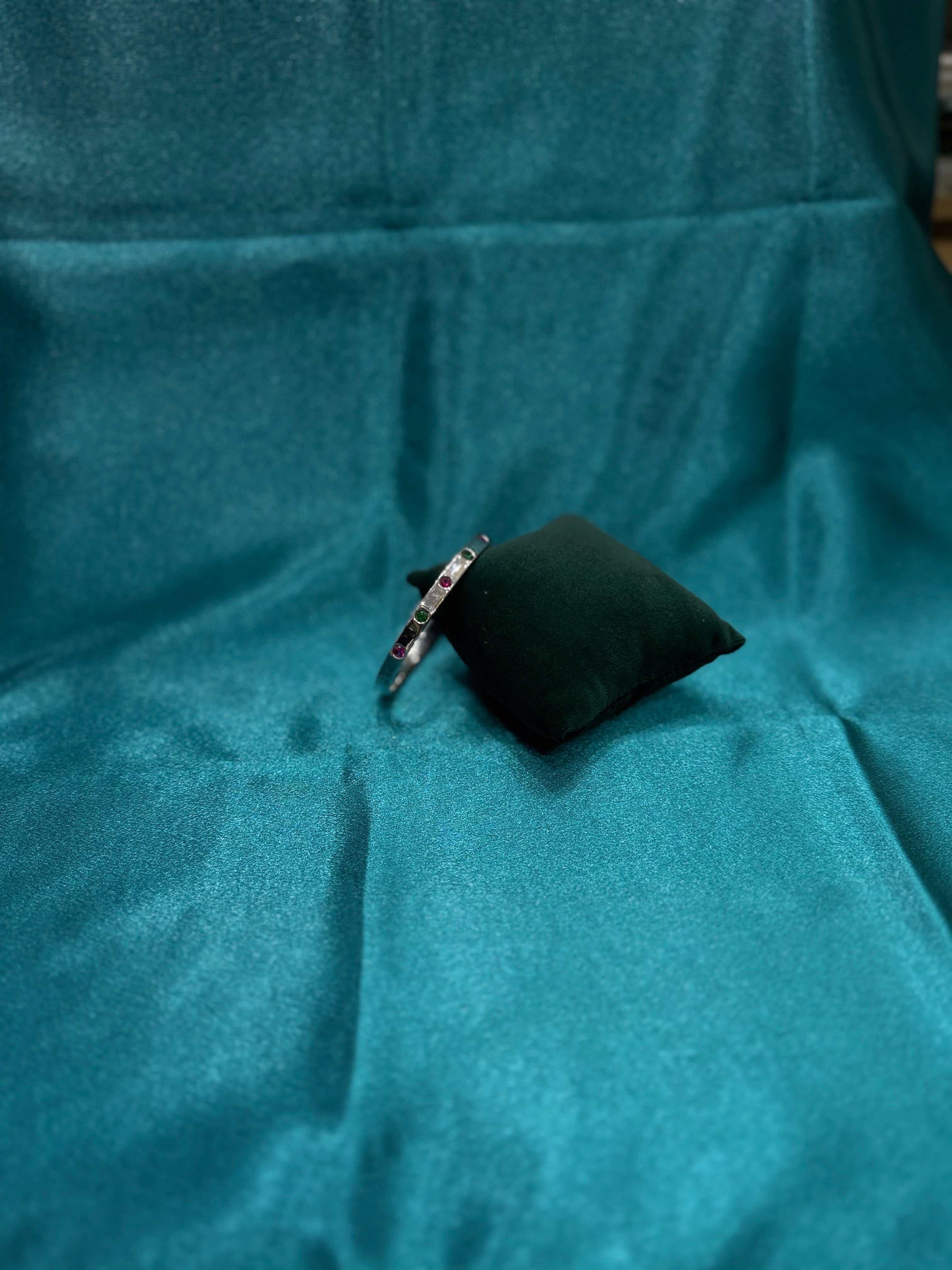 Fancy silver openable bangle with pink and green stone