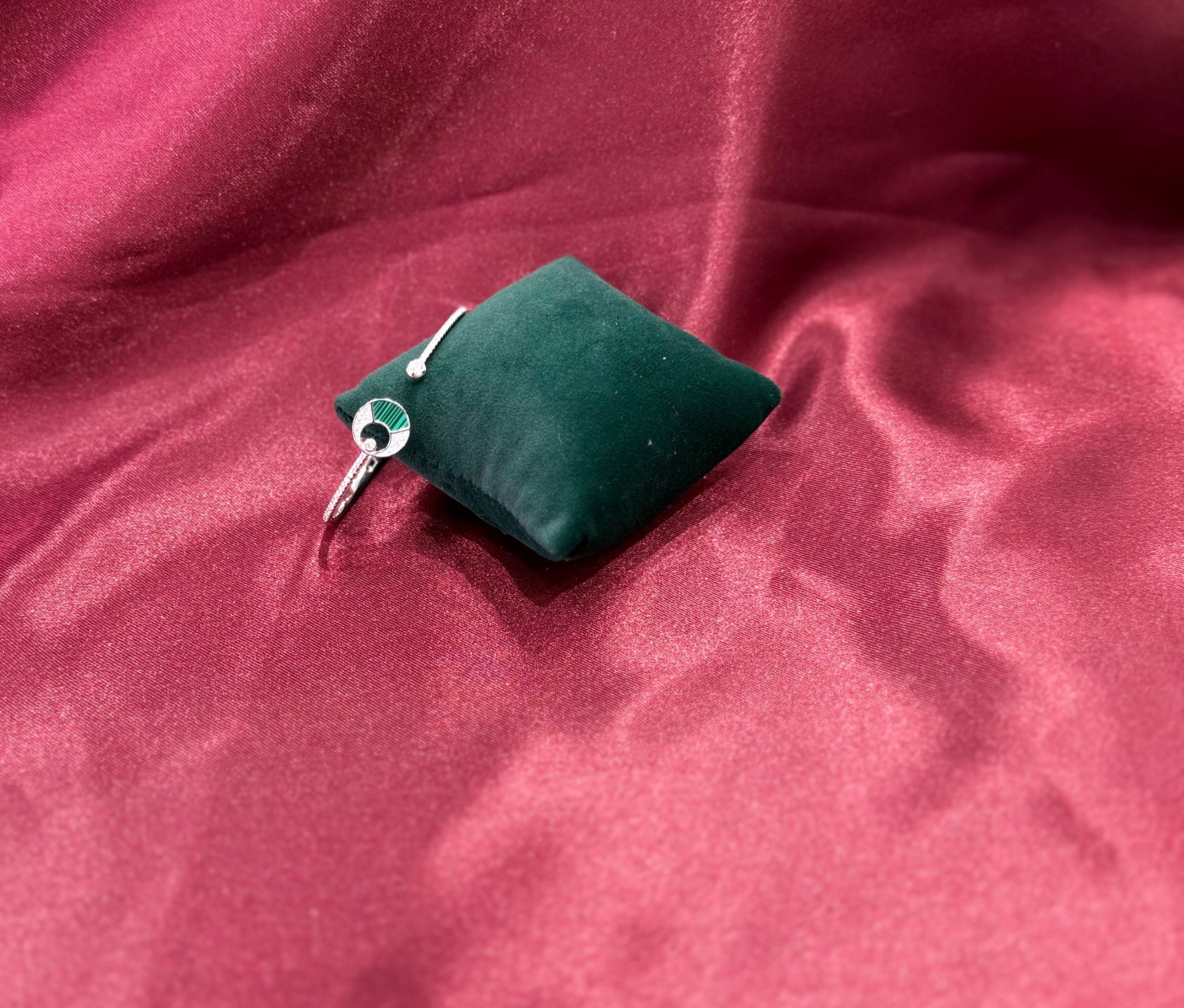 Fancy silver CZ diamond bangle with green stone