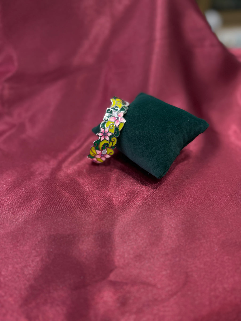 Fancy silver bangle with vibrant floral pattern