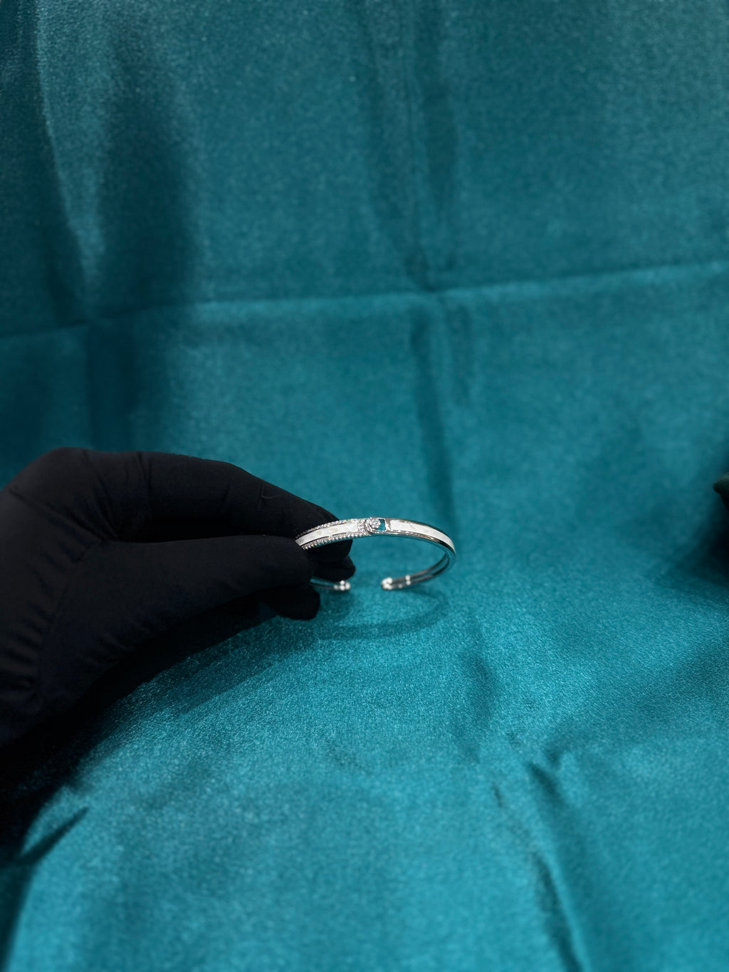 Fancy silver CZ diamond bangle with white colour on it