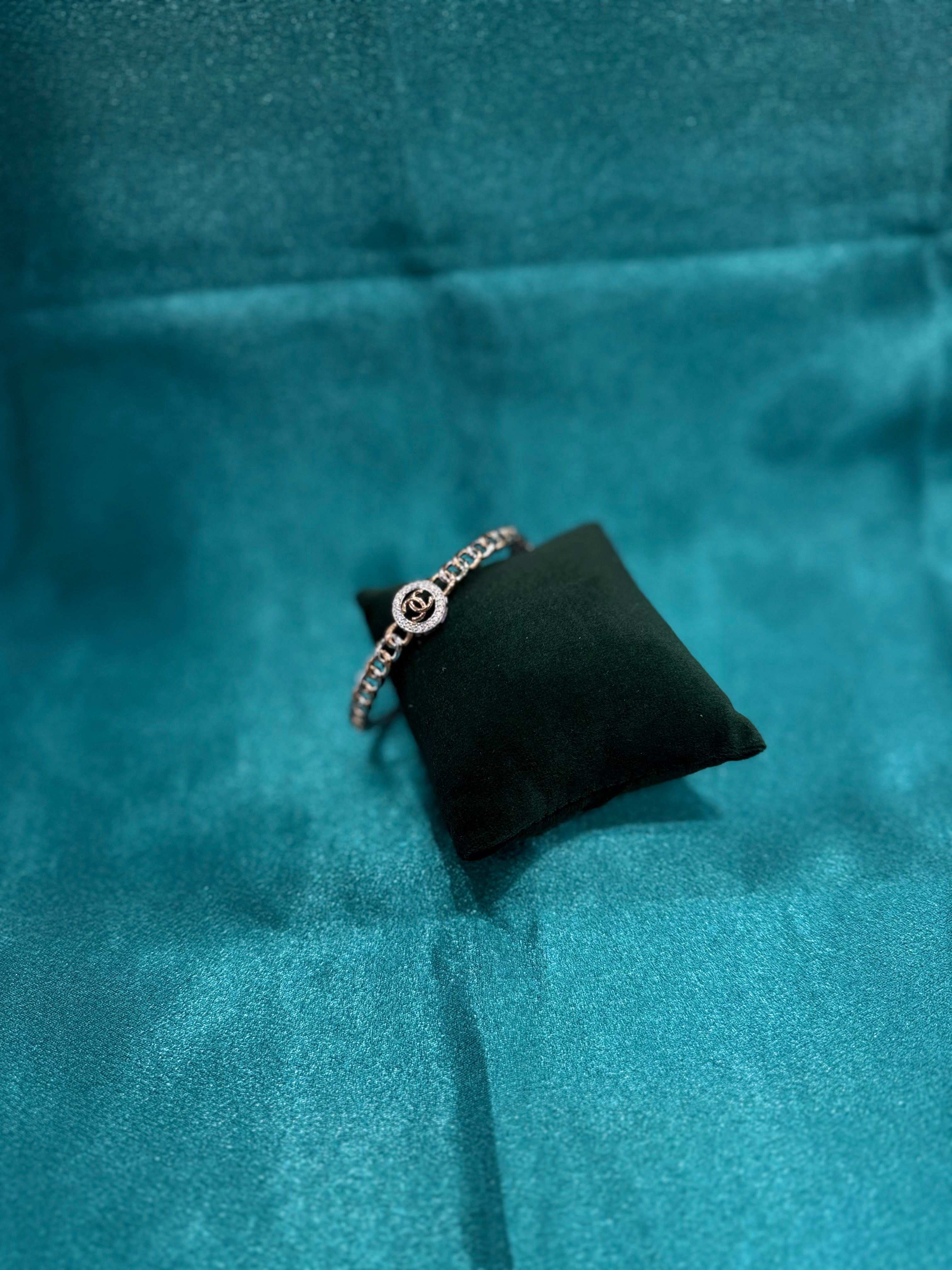 Fancy silver bangle inspired by channel style with rose gold plating