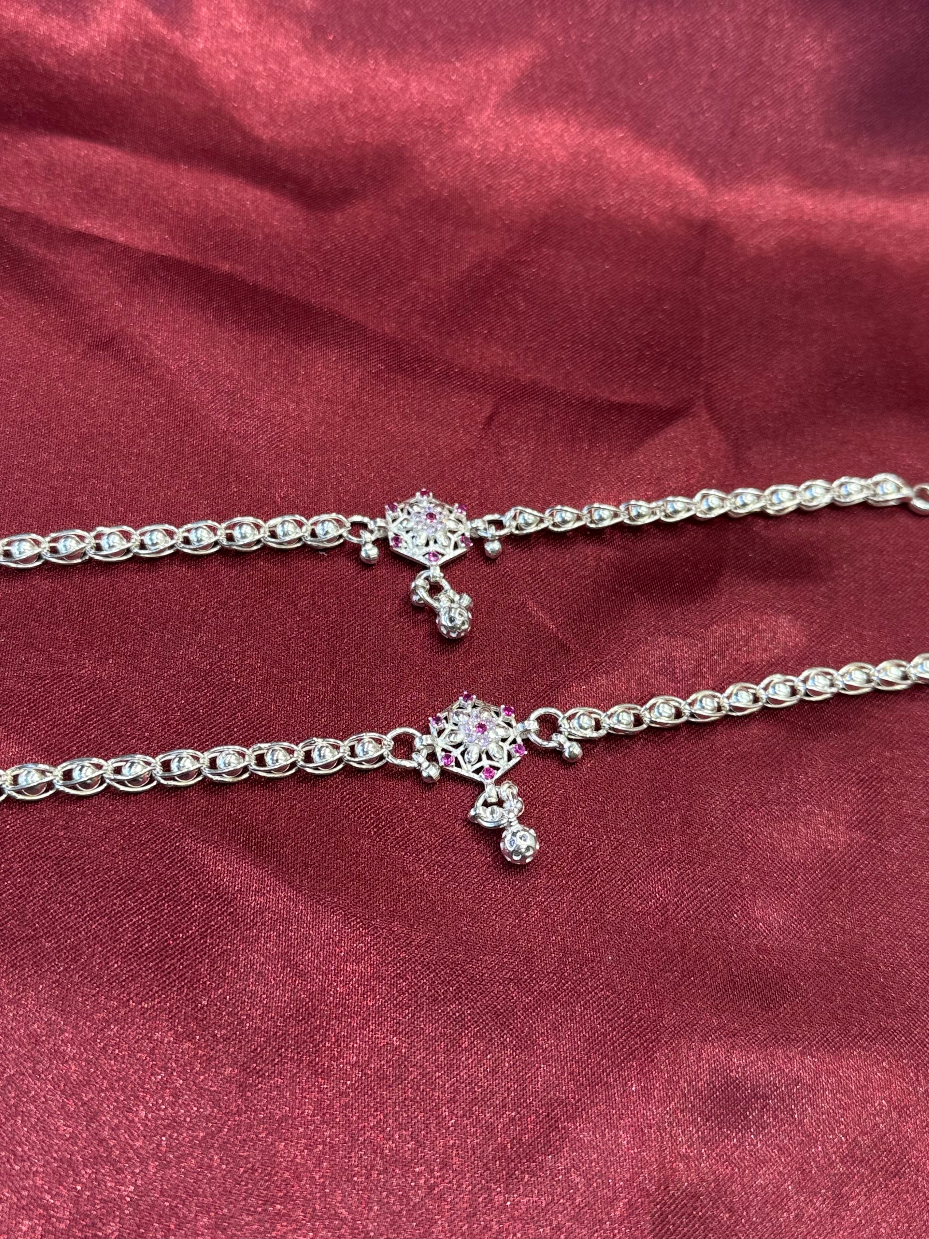 Kids fancy silver anklets with pink stone studded flower pattern in the centre (10-12 year old)