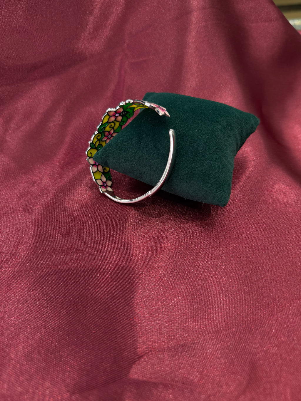 Fancy silver bangle with vibrant floral pattern