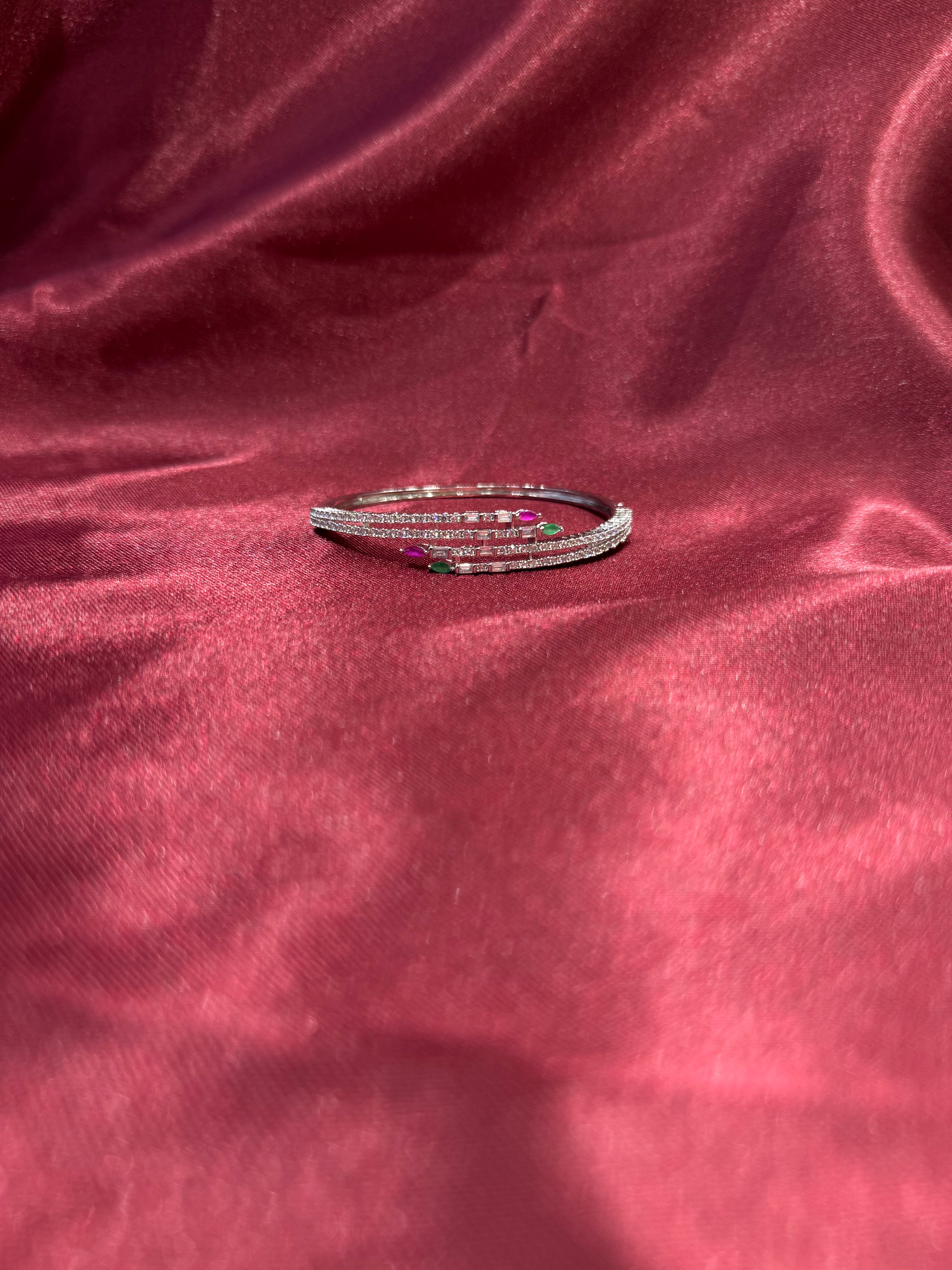 Fancy silver CZ diamond bangle with red and green stones