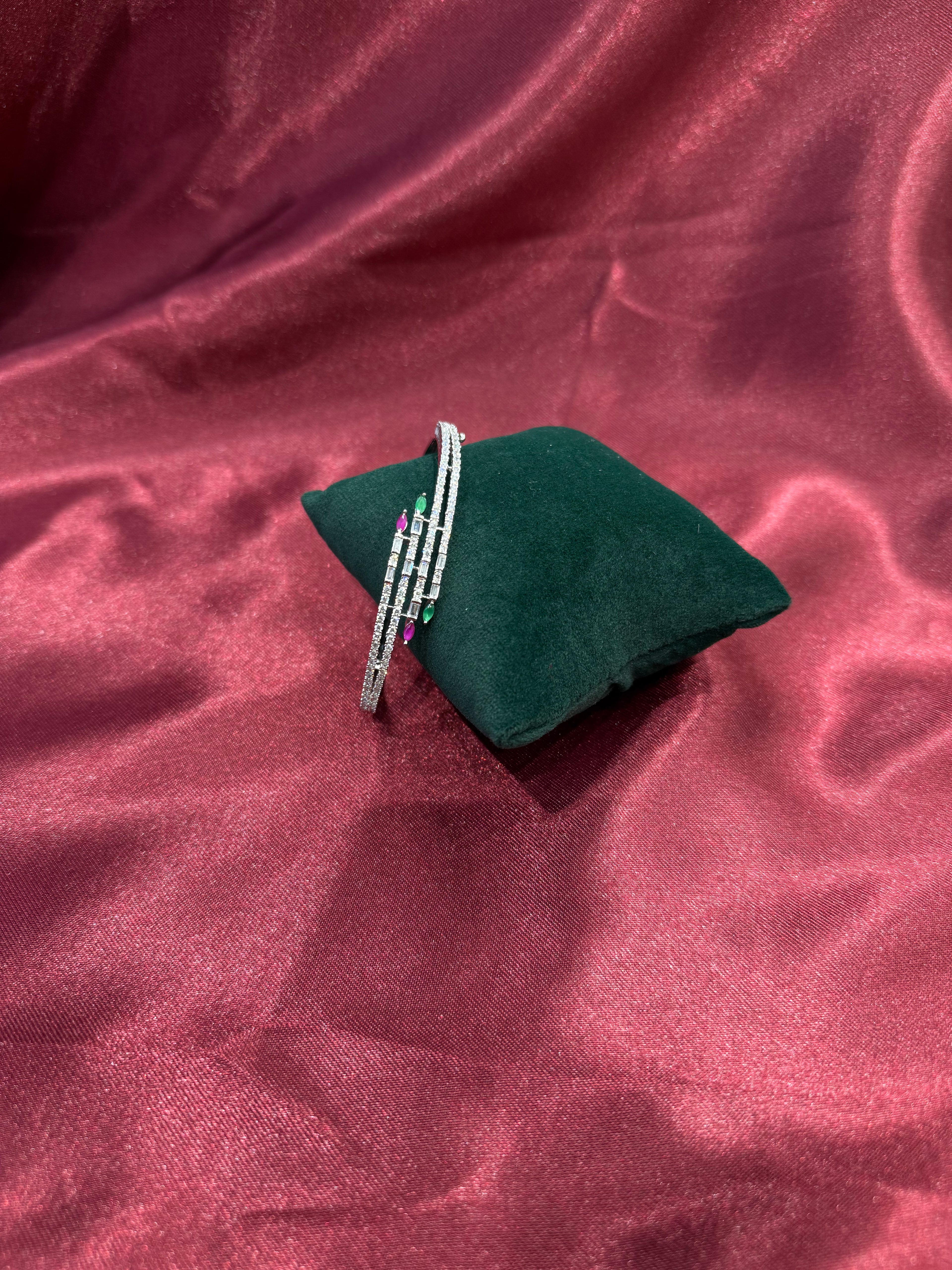 Fancy silver CZ diamond bangle with red and green stones