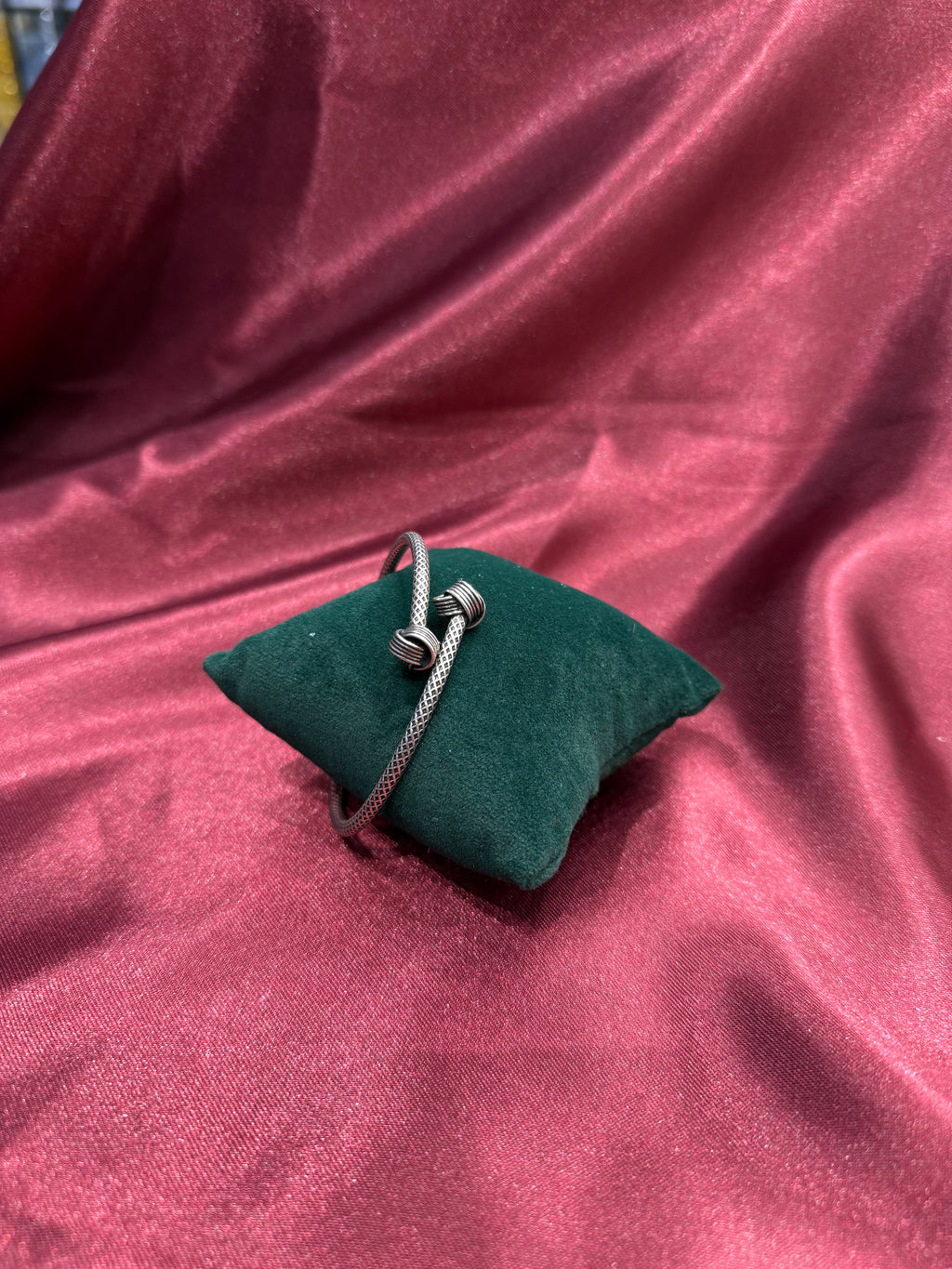 Fancy silver antique style open bangle with knot design