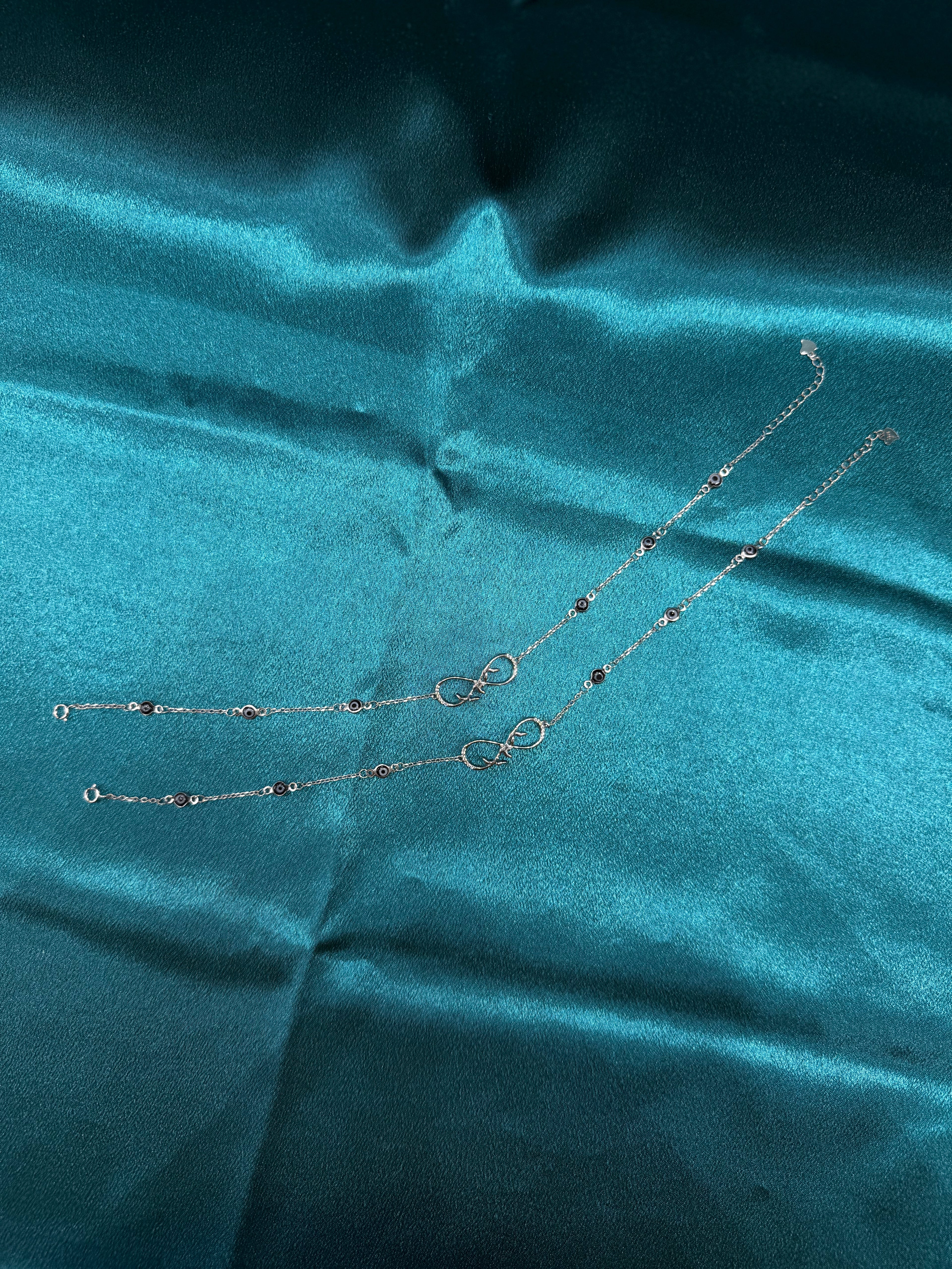 Fancy silver anklet with infinity and evil eye design
