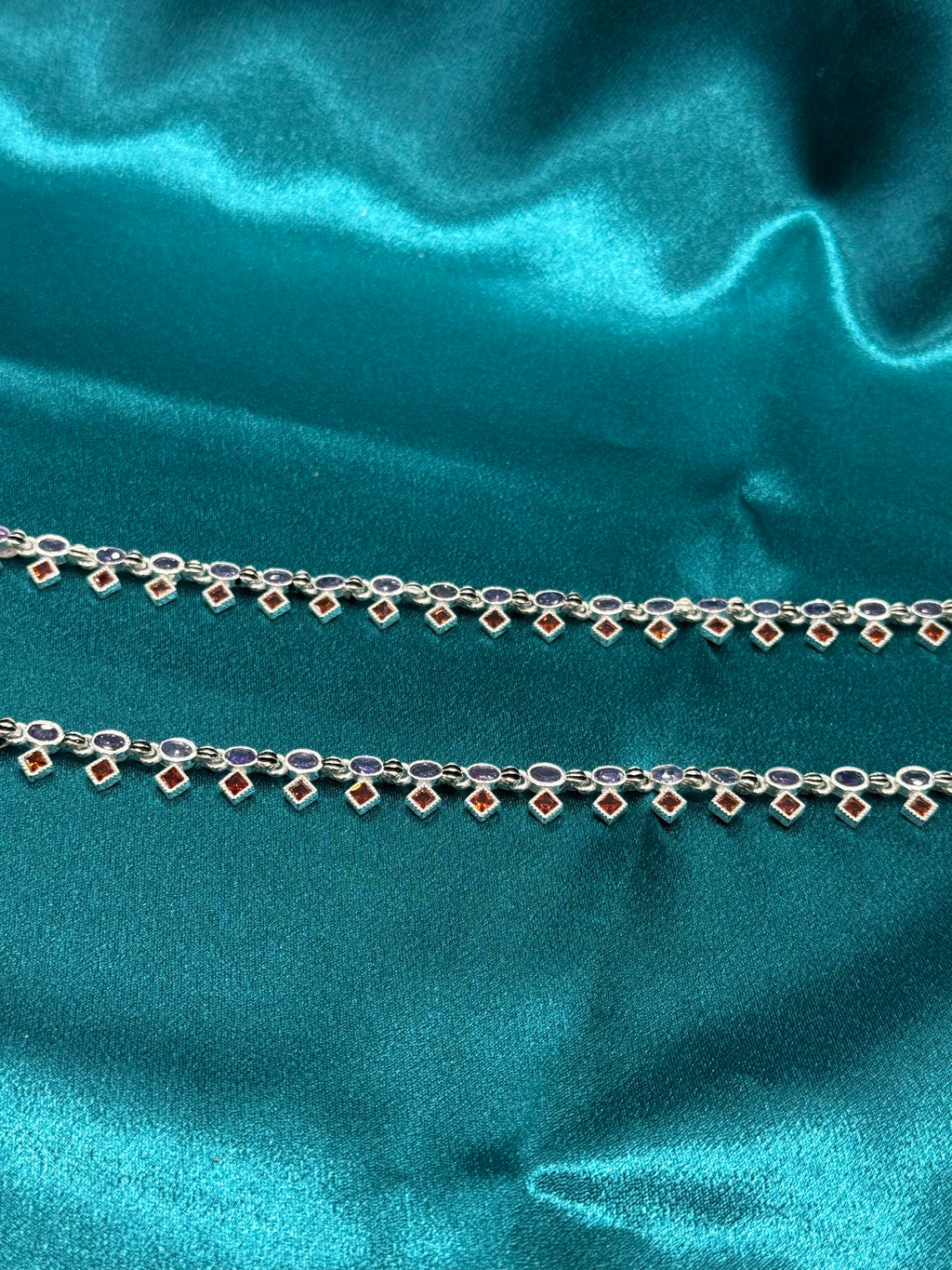 Fancy silver anklets with purple and orange CZ stones